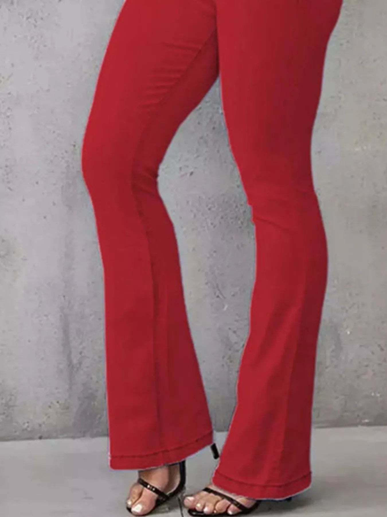 High-waisted flare jeans from Trendsi, showcasing their stylish fit and denim texture in a natural pose.