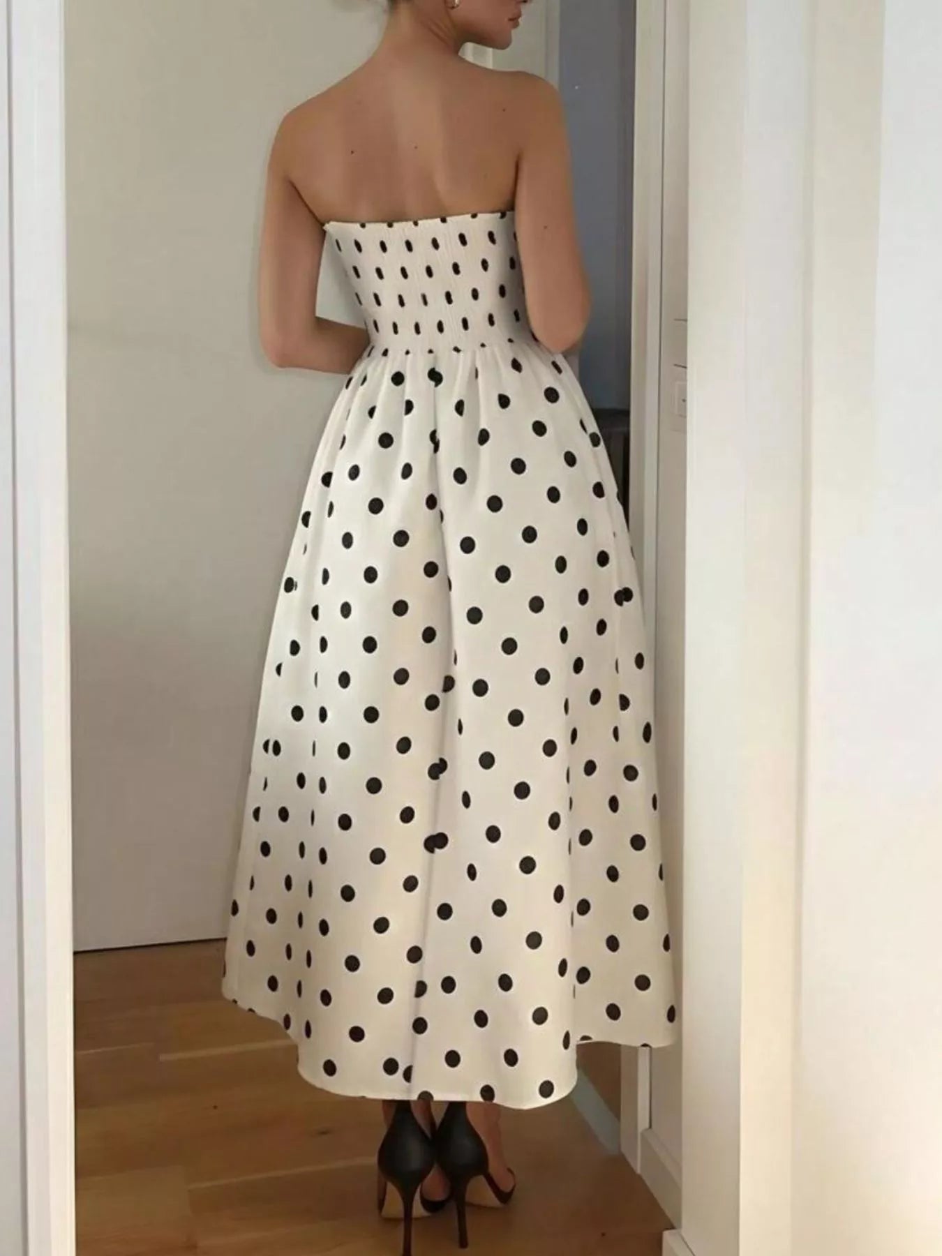 Polka dot strapless midi dress by Trendsi featuring a fitted bodice and flowing skirt, perfect for summer occasions.