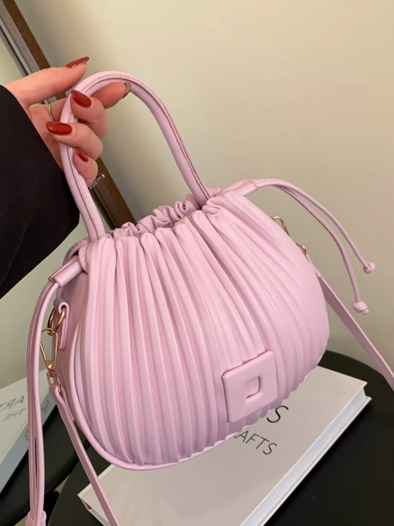 Trendsi pleated bucket crossbody bag in beige with adjustable strap and stylish design, perfect for casual and chic outfits.