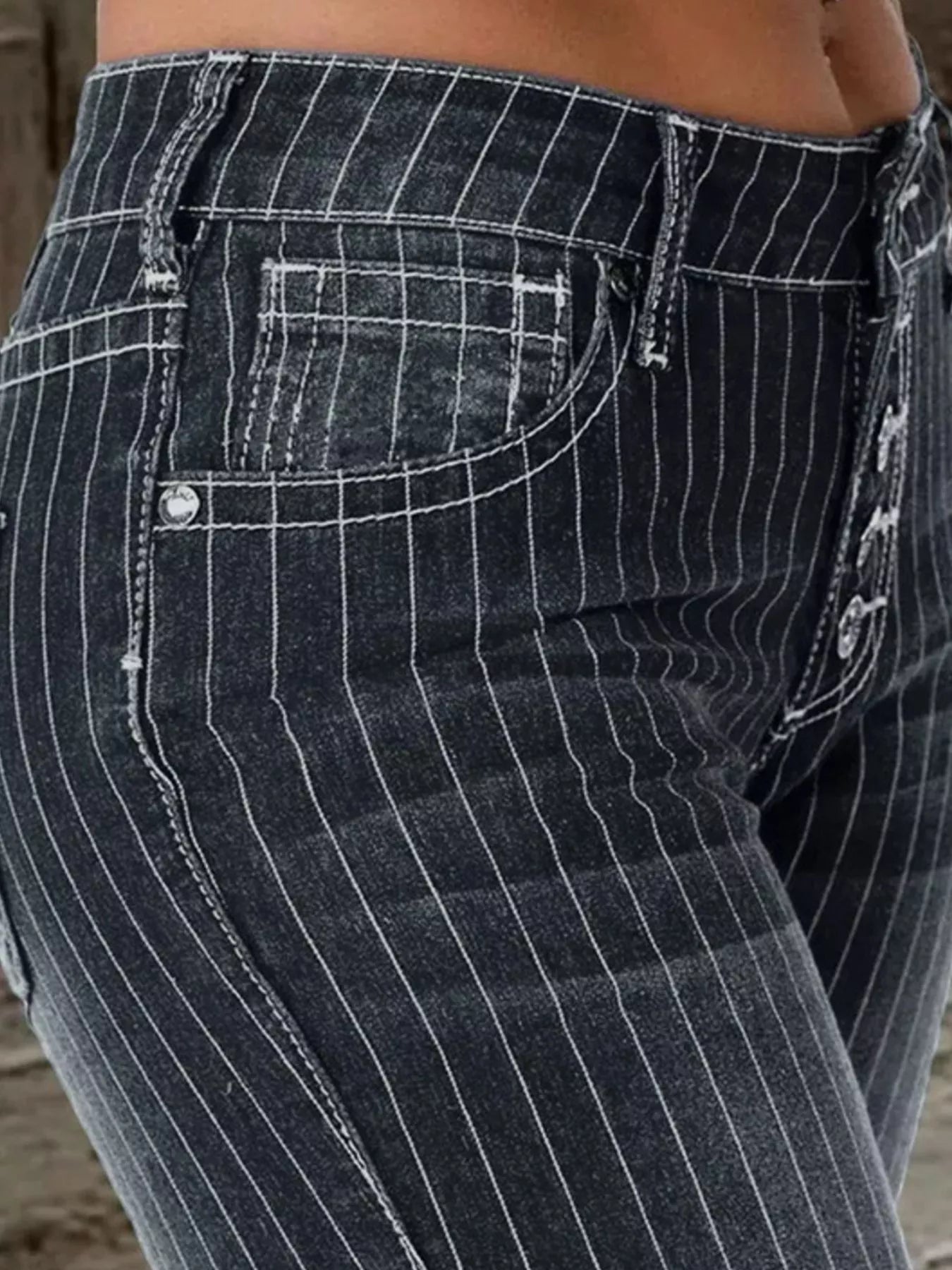 Striped button fly flare denim jeans from Trendsi featuring a stylish pattern and classic fit.