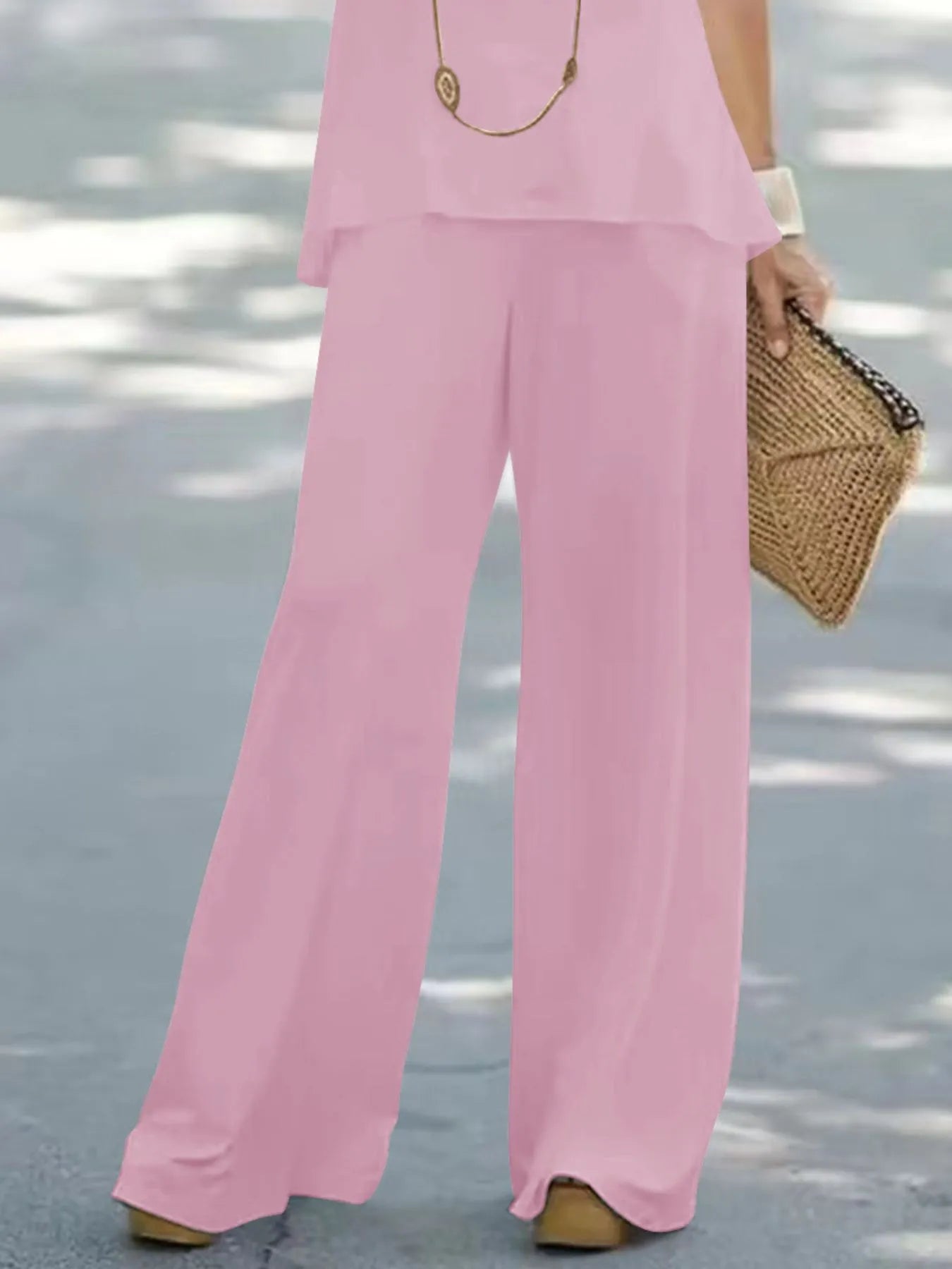 Trendsi halter top and wide-leg pants set, featuring a stylish halter top with matching flowy wide-leg pants, in a trendy design.
