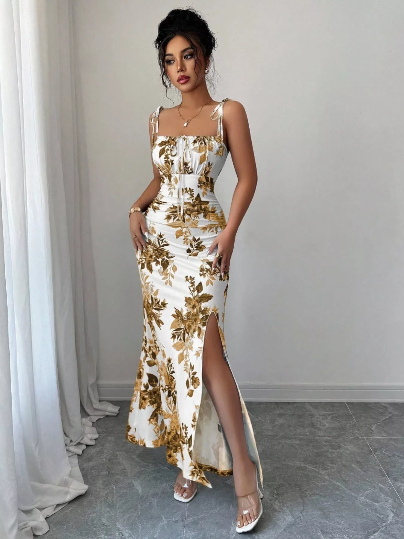 Printed tie strap slit maxi dress by Trendsi featuring a flowy silhouette, adjustable straps, and a side slit for a stylish look.