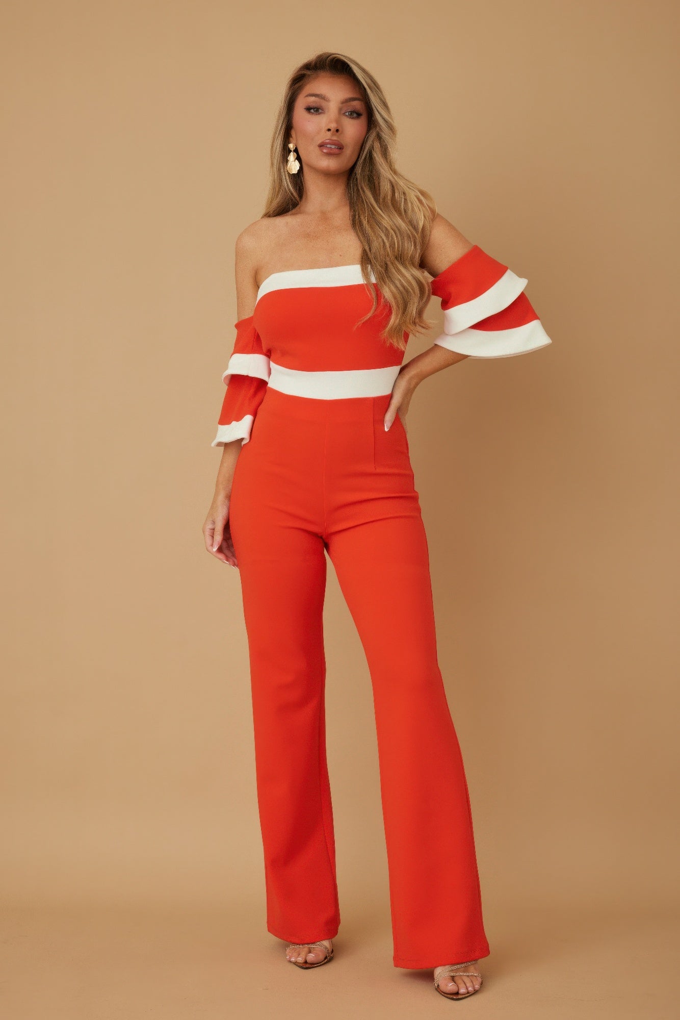 Off shoulder black and white color combo jumpsuit by Toshe Women's Fashions, displayed on a model with stylish details.