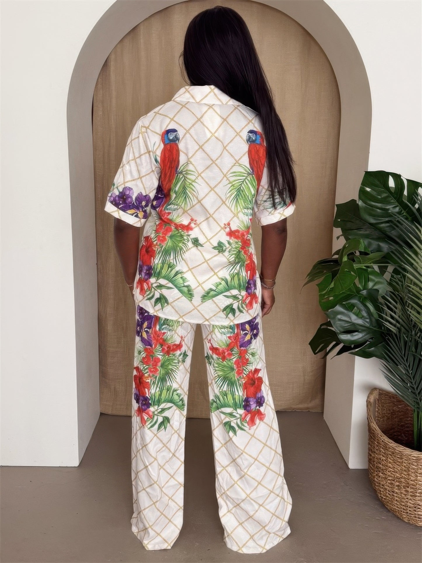 Tropical parrot print shirt and pants set for women by Toshe Women's Fashions, featuring vibrant bird and foliage designs.