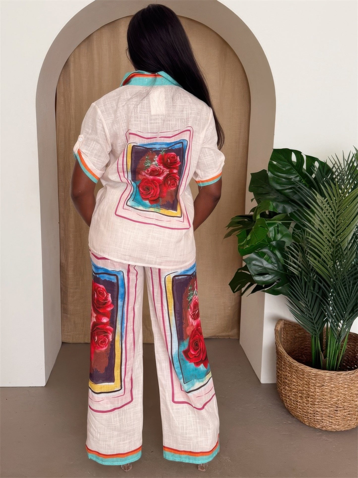 Floral print Toshe Women's Fashions resort pants set with button-up top and matching wide-leg pants, perfect for summer wear.