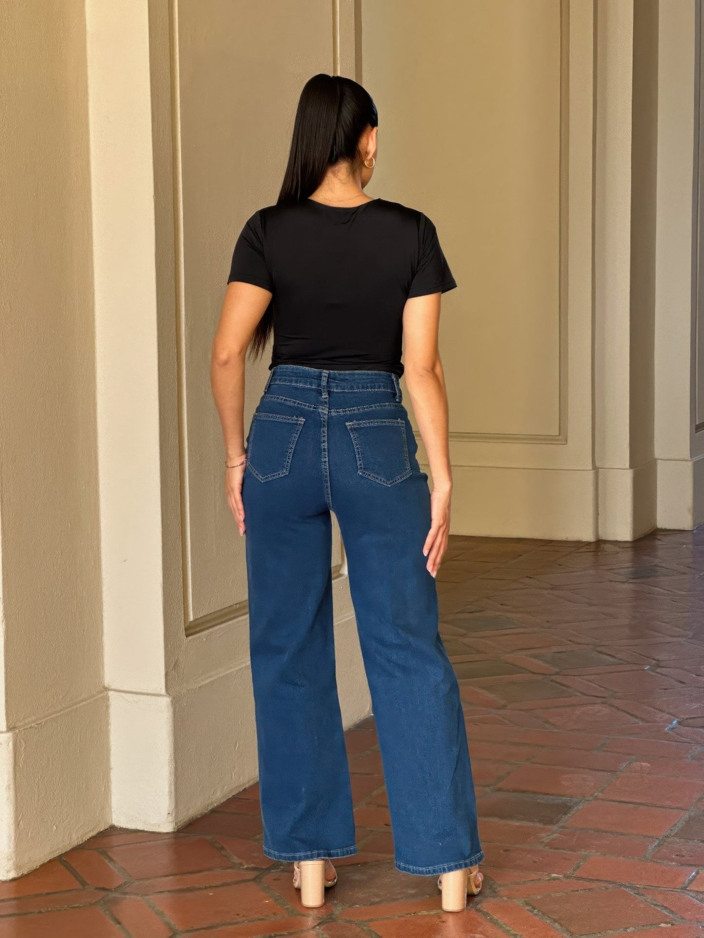 Distressed wide-leg denim jeans with embroidered heart design by Toshe Women's Fashions, shown with a relaxed fit and casual style.