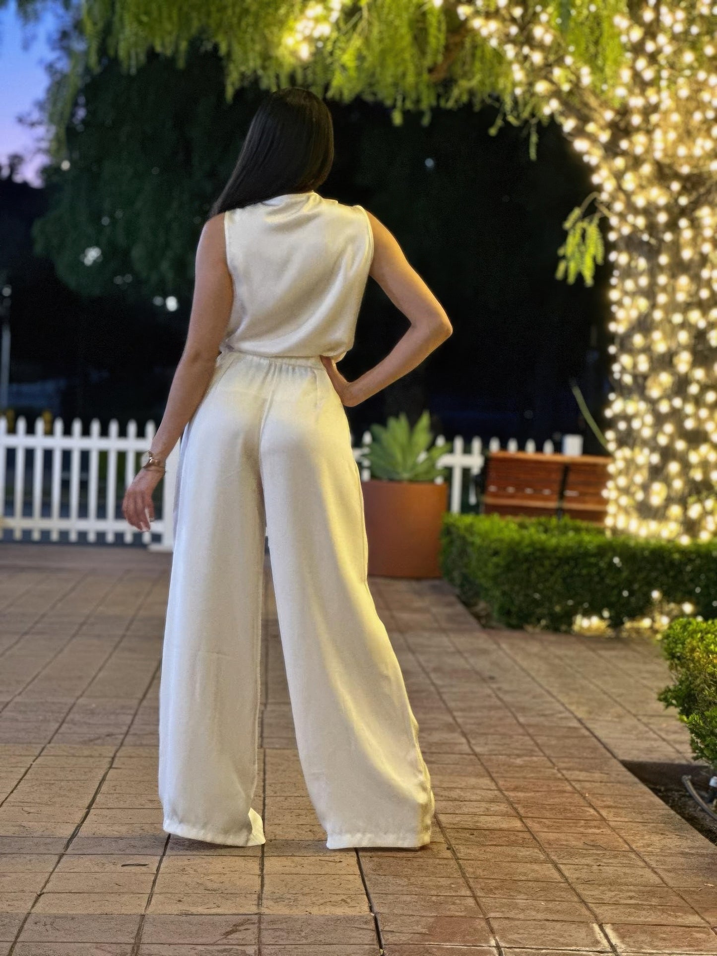 Satin wide-leg pants and a sleeveless floral top set for women from Toshe Women's Fashions, shown on a model.