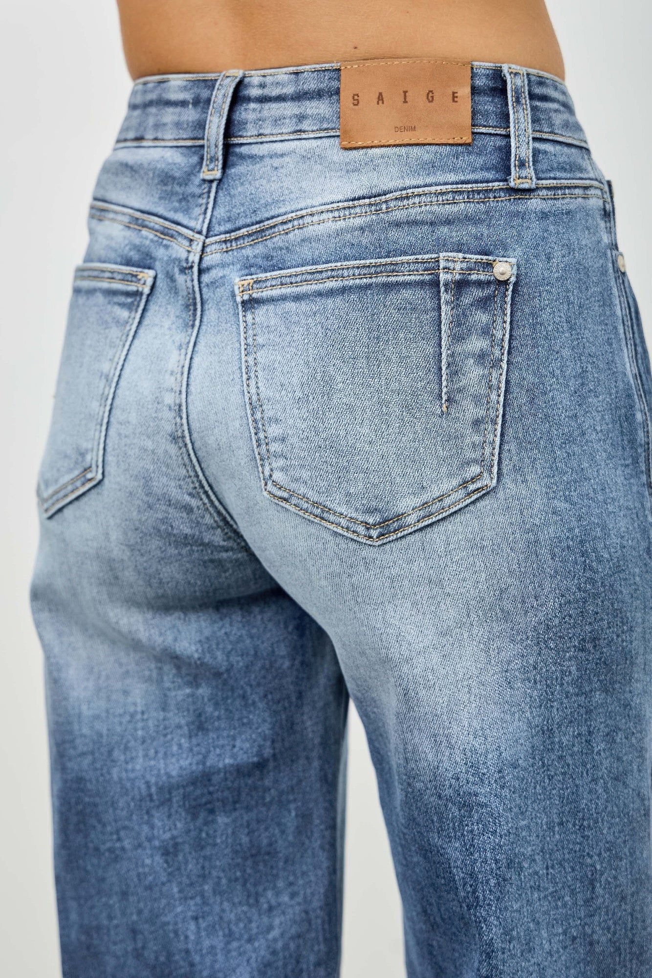 Toshe Women's Fashions mid-rise straight jeans with pintuck detailing, denim fabric, and classic fit.