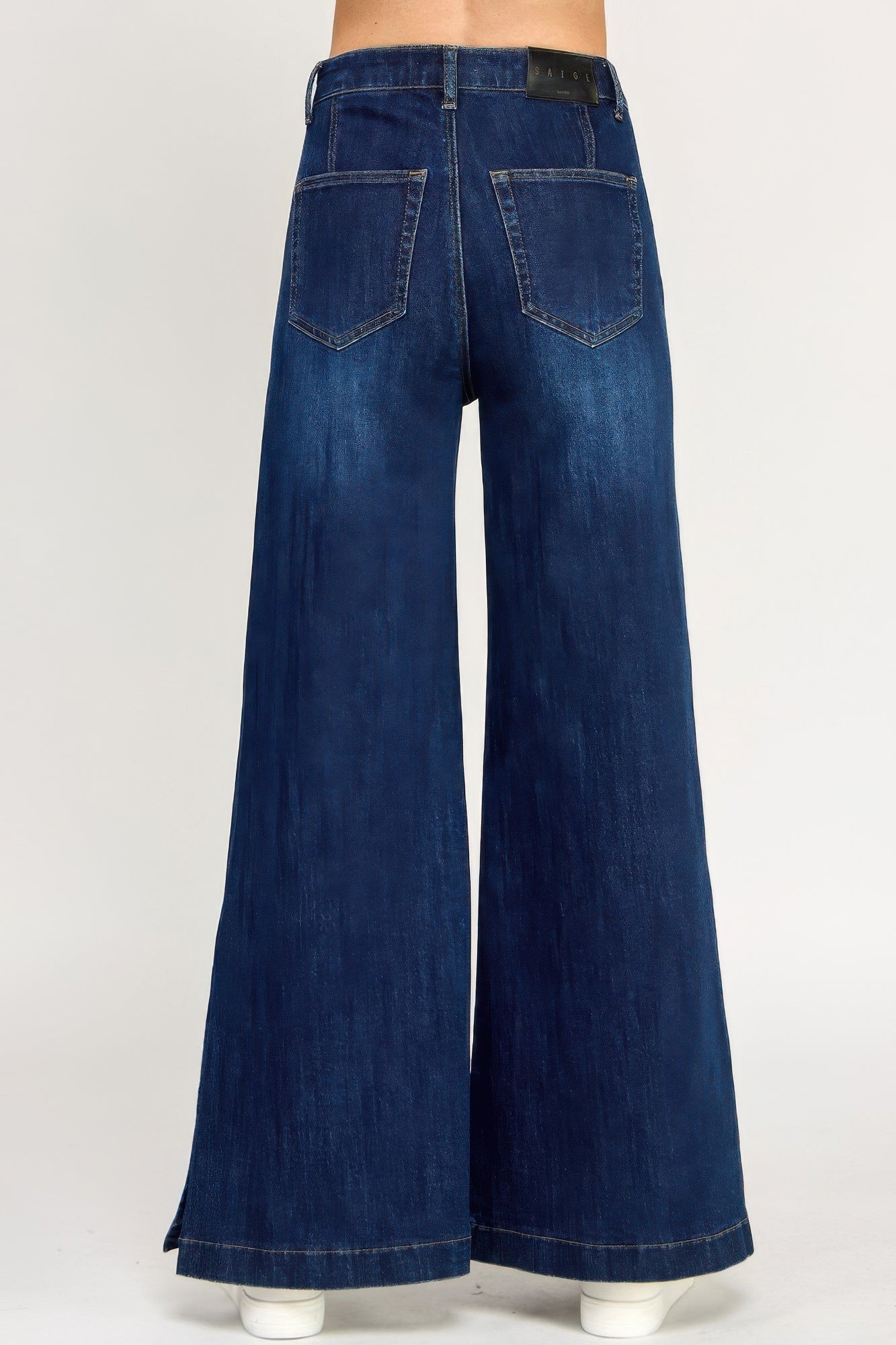 Toshe Women's Fashions high rise wide leg pants with button slit detail, shown in a stylish fit on a model.
