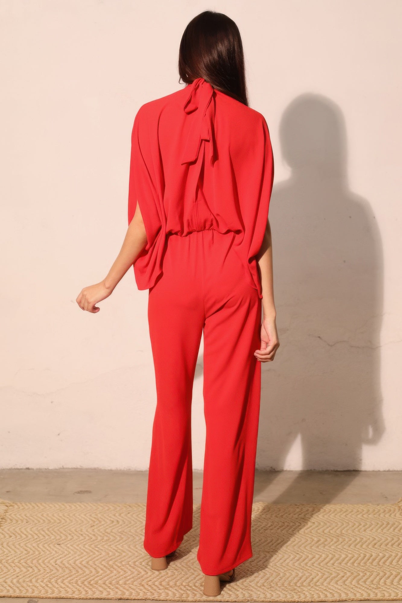 Textured solid mock neck caftan jumpsuit from Toshe Women's Fashions, featuring a relaxed fit and stylish design.