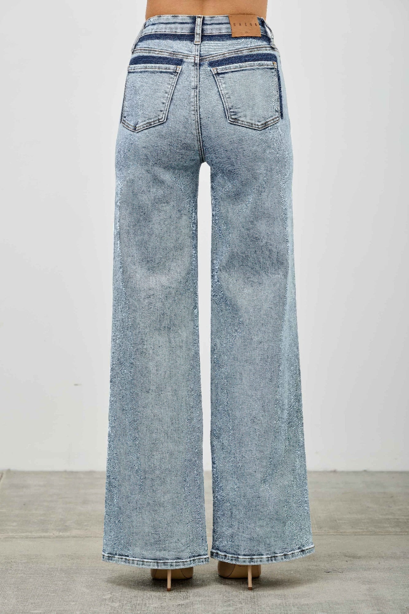 Light blue high rise relaxed straight jeans with seam detail from Toshe Women's Fashions, showing the fit and design.