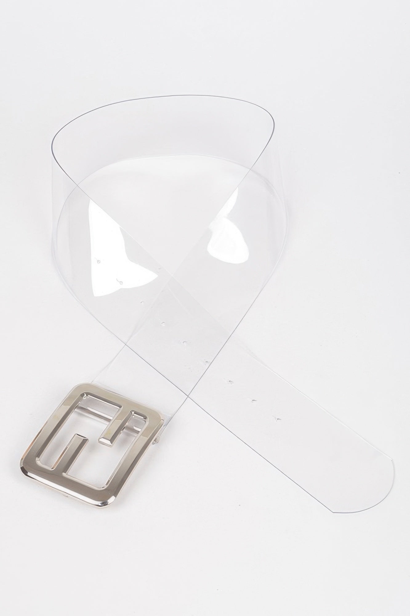 Clear belt with metal buckle from Toshe Women's Fashions, showcasing a sleek, transparent design and silver-toned buckle detail.