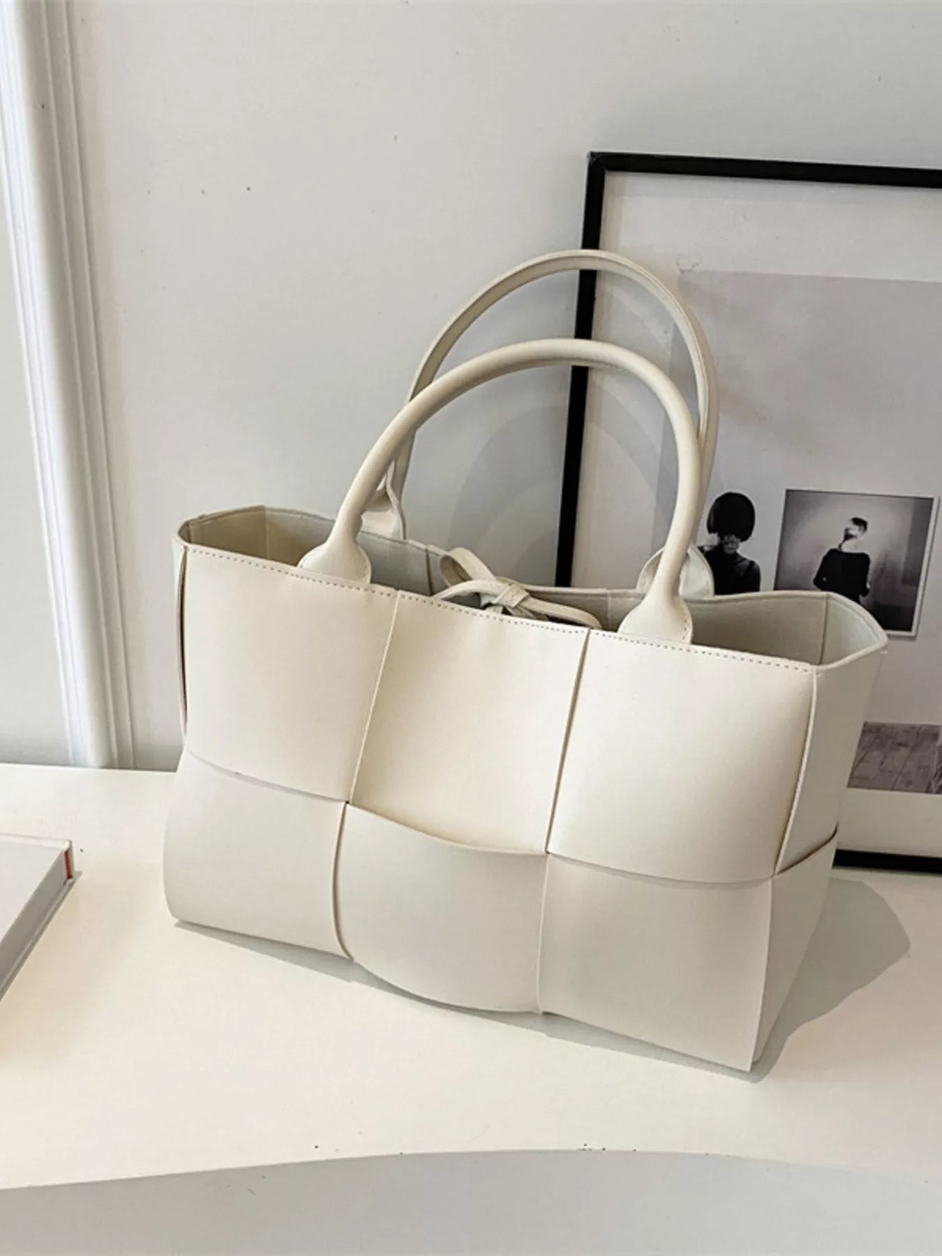 Woven leather tote bag from Trendsi, stylish handbag with textured design and sturdy handles, perfect for everyday use.