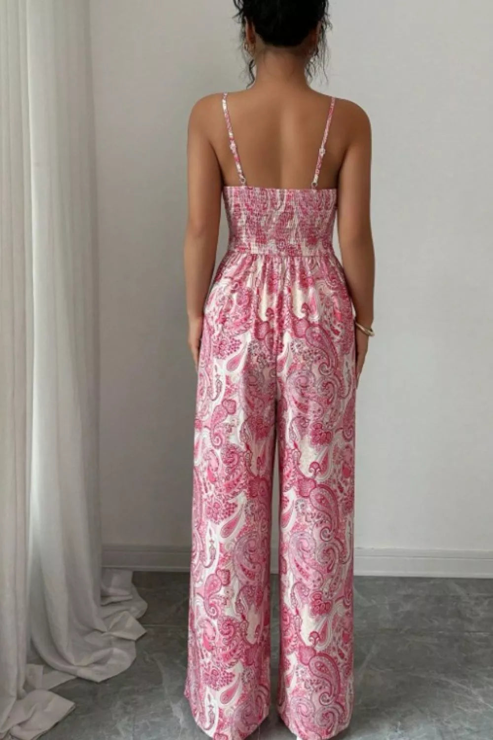 Pink paisley wide leg jumpsuit from Trendsi, featuring a flowy fit and stylish pattern, displayed on a mannequin.