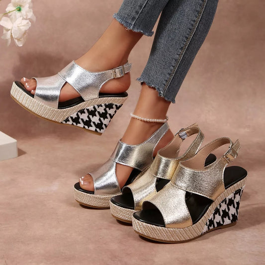 Open toe wedge sandals by Trendsi featuring a stylish design with a cork heel and adjustable ankle strap.