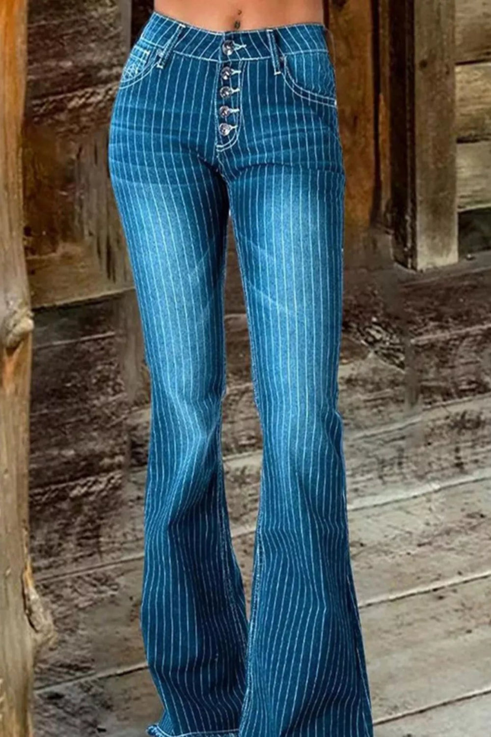Striped button fly flare denim jeans from Trendsi featuring a high waist, bold stripe pattern, and wide-leg flare style.