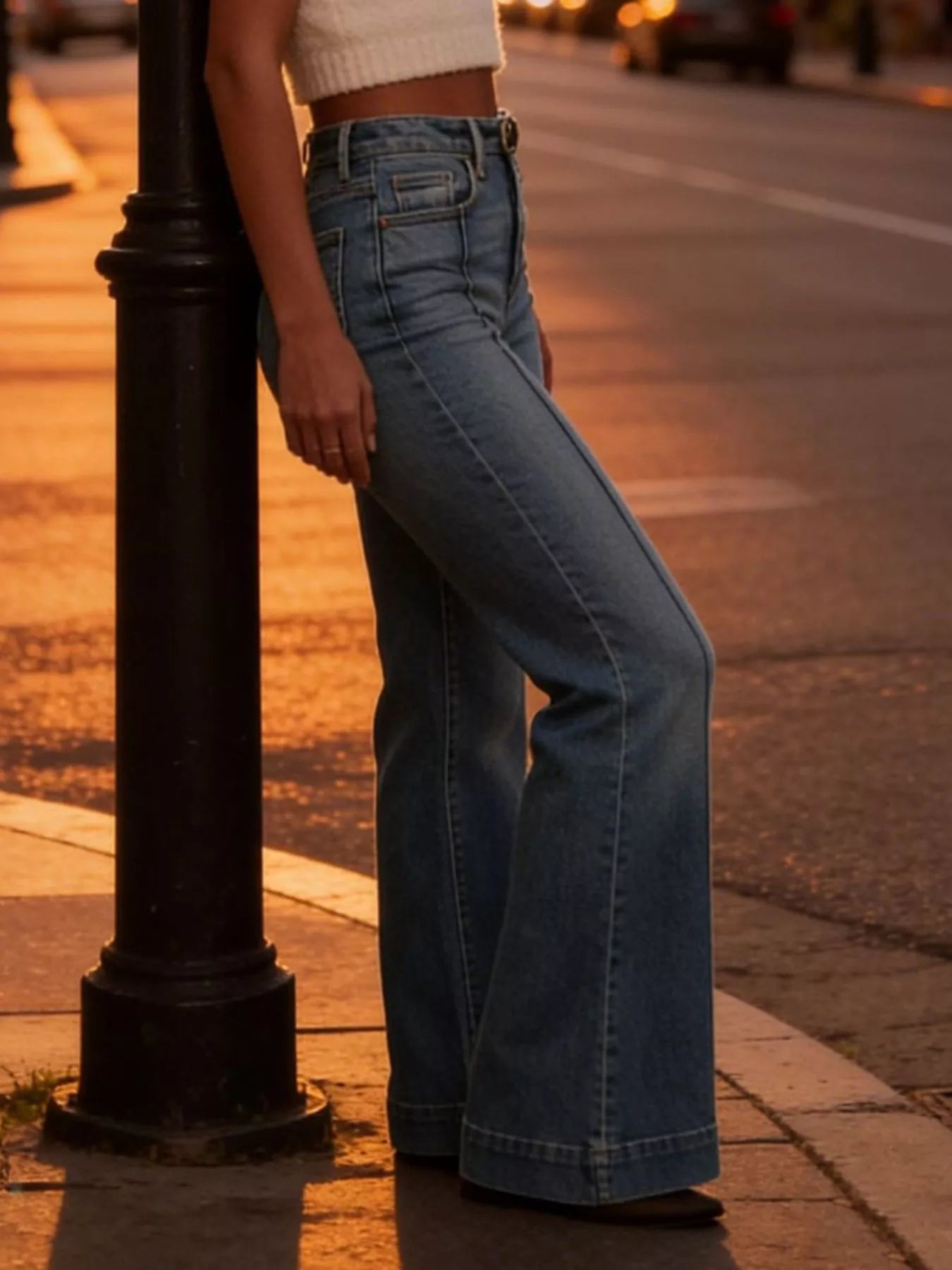 High-waisted flare leg denim jeans from Trendsi, showing the fit and style with a classic blue wash and wide flare at the hem.