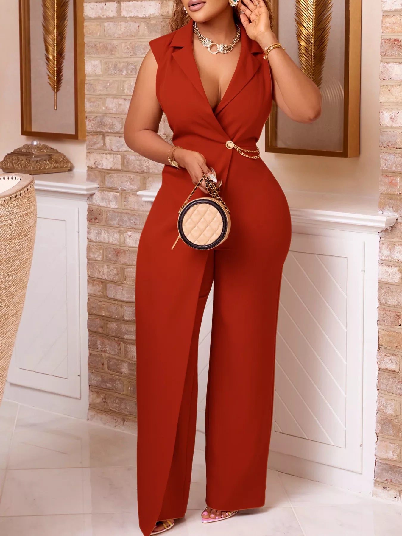 Asymmetrical sleeveless blazer-style wide-leg jumpsuit by Trendsi, featuring a modern design and tailored fit in a sleek fabric.