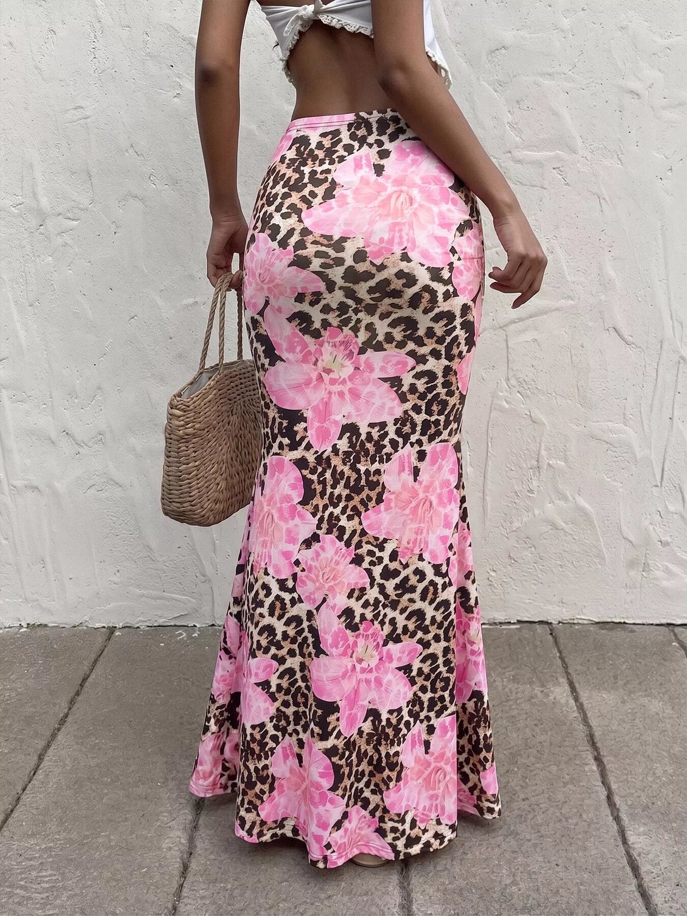 Leopard print bodycon maxi skirt by Trendsi featuring a fitted silhouette and bold animal pattern.