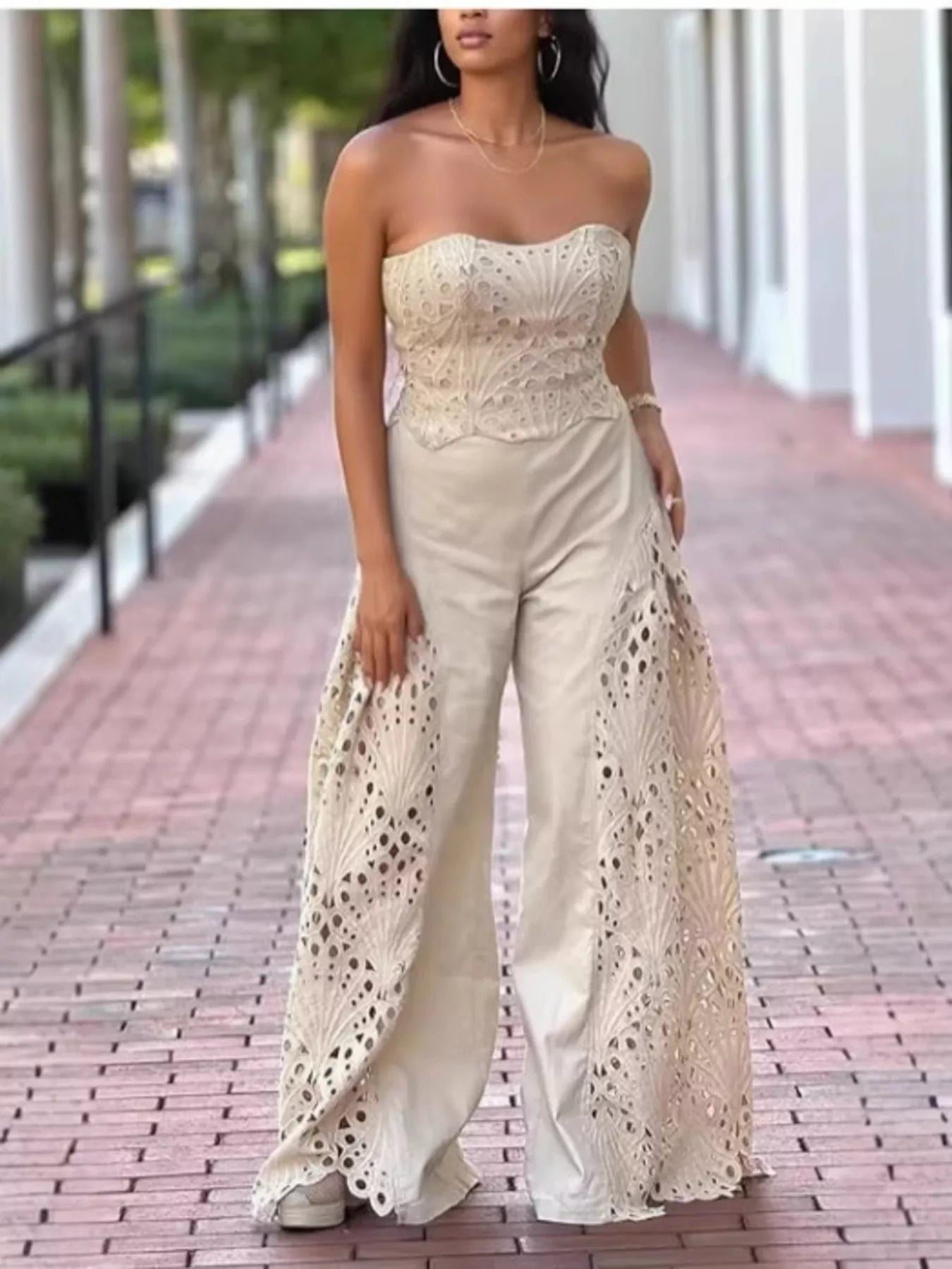 Hollow-out tube top and pants set by Trendsi, stylish 2-piece fashion ensemble with cut-out details and modern design.
