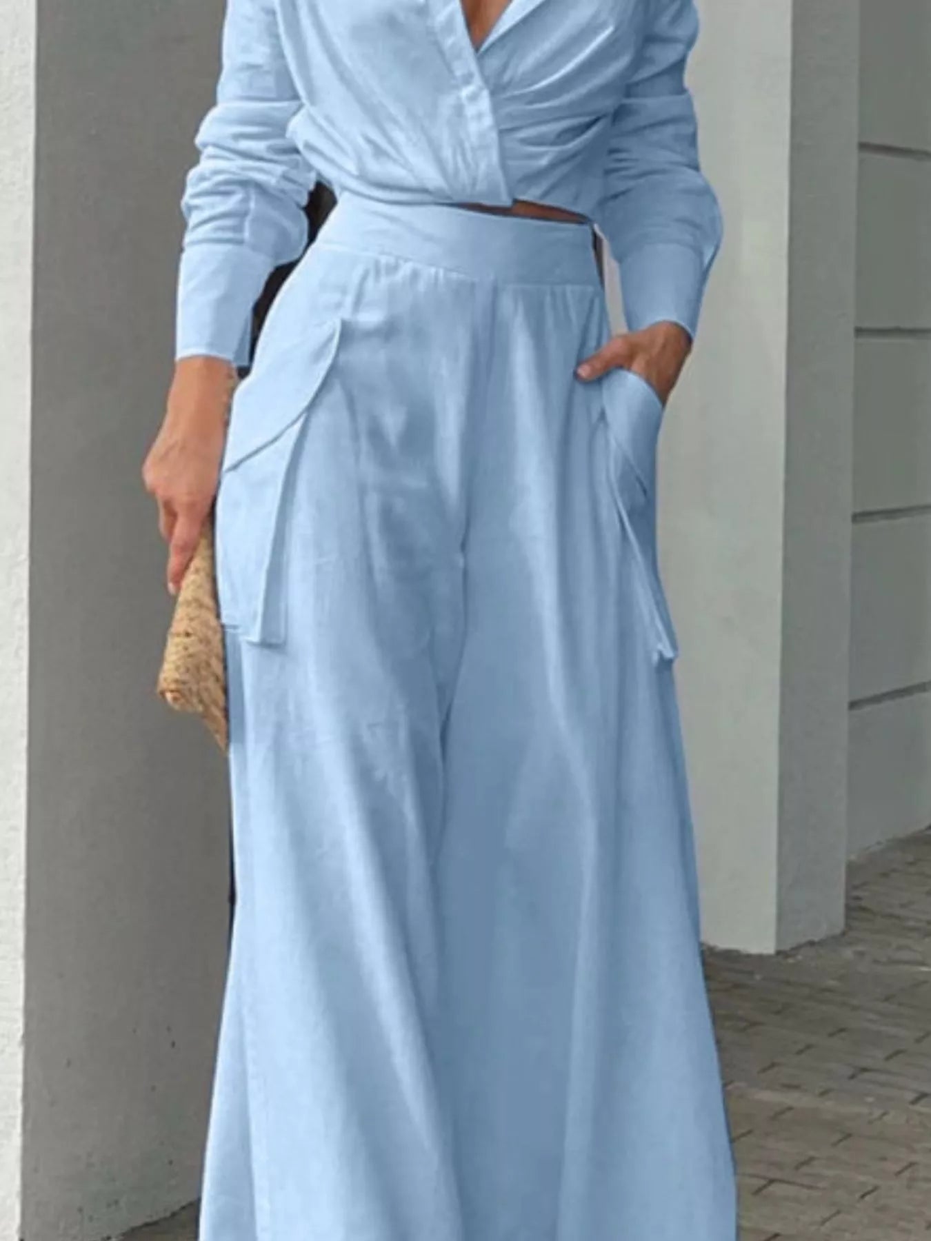Button front shirt and pocketed wide-leg pants set by Trendsi, featuring a stylish button-up shirt and flowy pants.