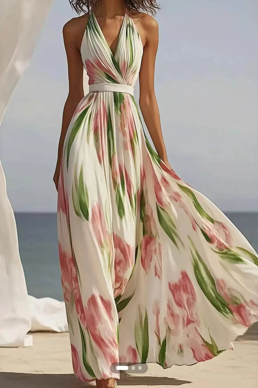 Floral print halter neck maxi dress by Trendsi featuring a flowing silhouette and vibrant flower pattern.