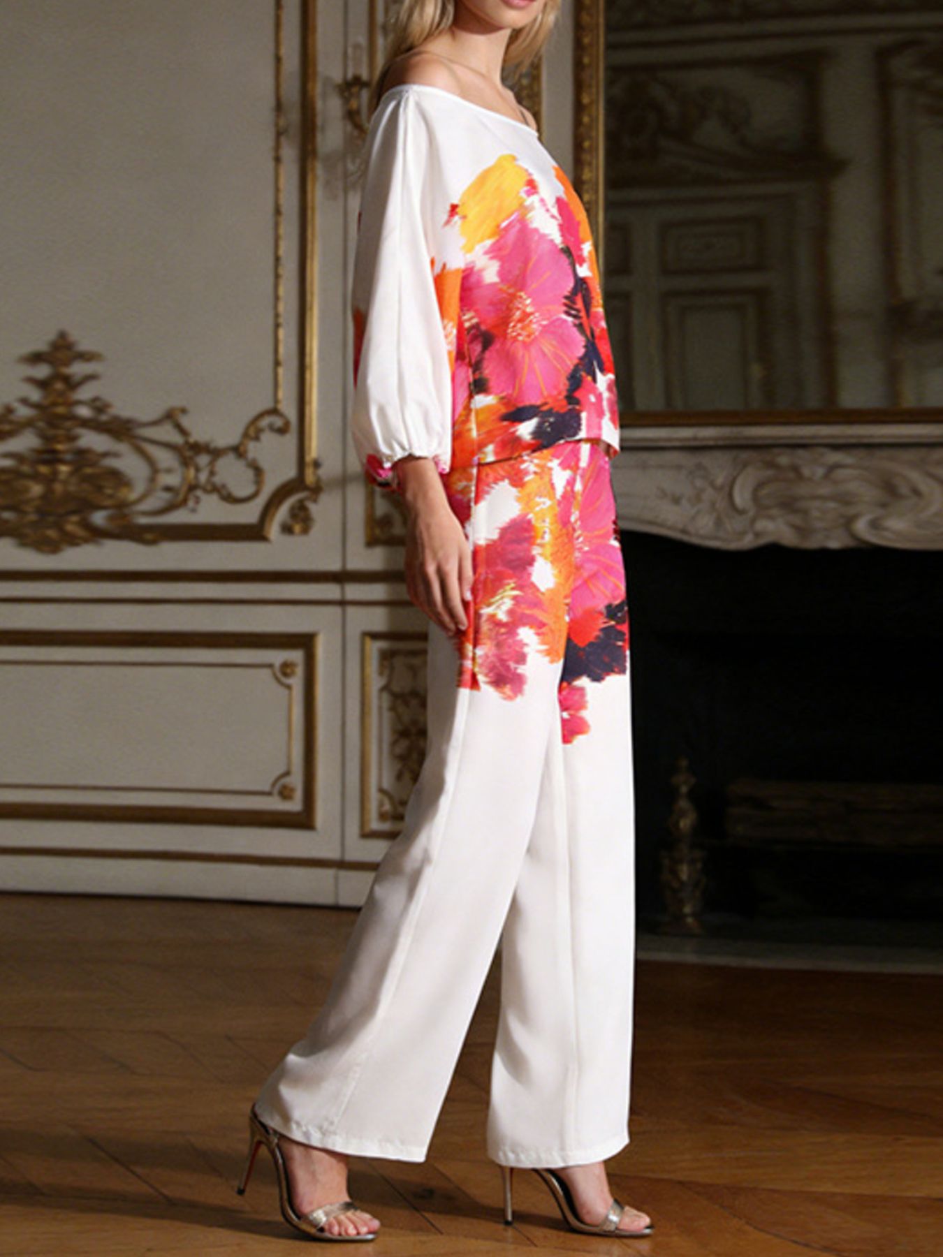 Floral print off-shoulder top and pants set by Trendsi, featuring a matching two-piece outfit with vibrant floral design.