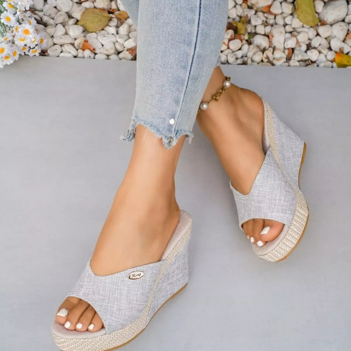 Open toe wedge sandals by Trendsi featuring a stylish design with a comfortable platform and ankle straps, perfect for warm weather.
