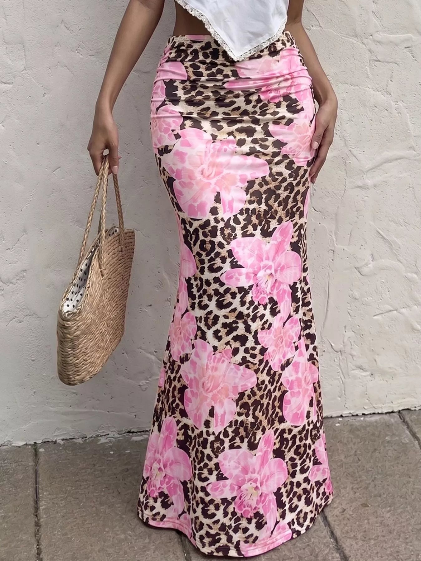 Leopard print bodycon maxi skirt from Trendsi, fitted design with bold animal pattern, flowing length and stylish look.