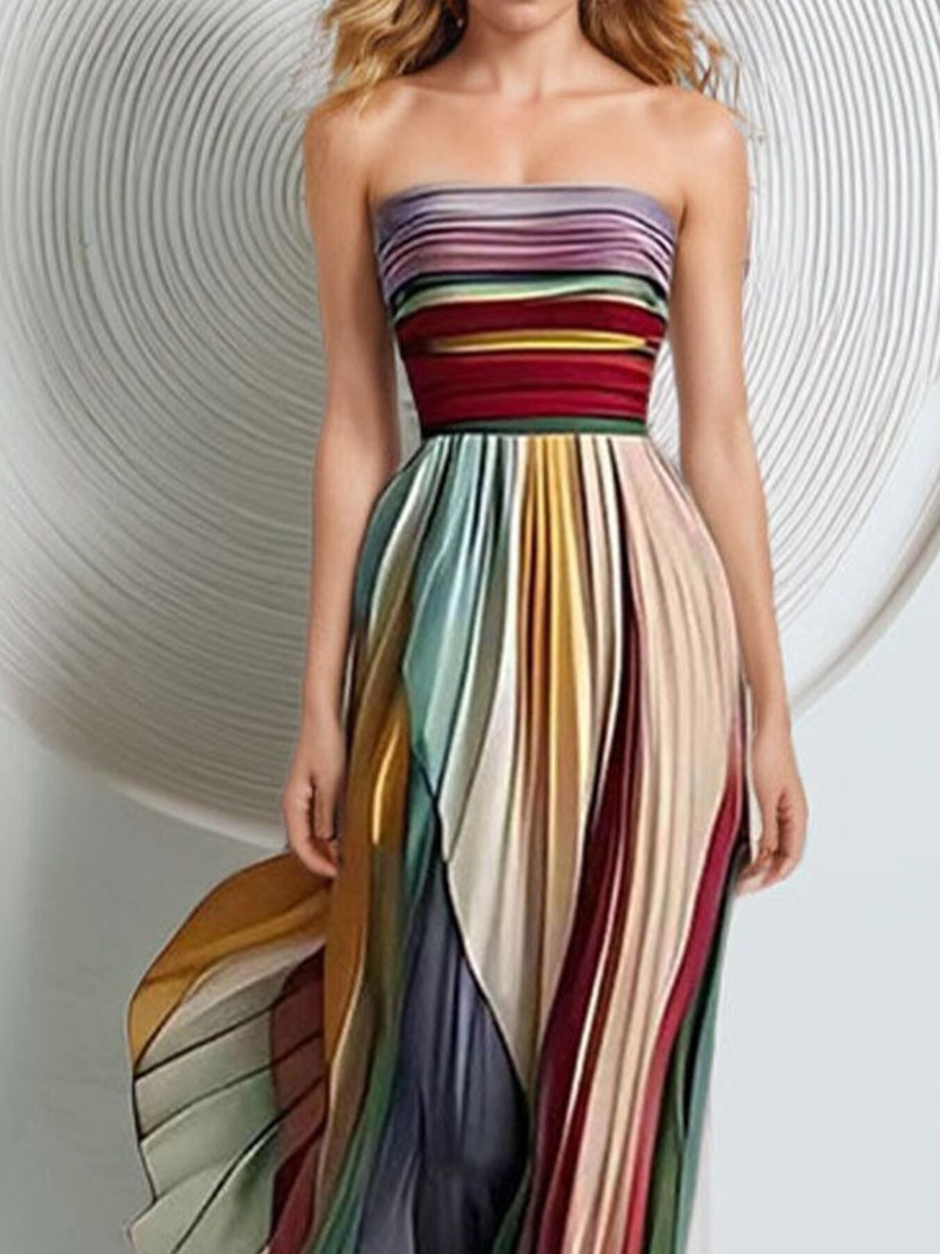 Striped pleated strapless maxi dress from Trendsi featuring a flowing silhouette and vibrant vertical stripes.