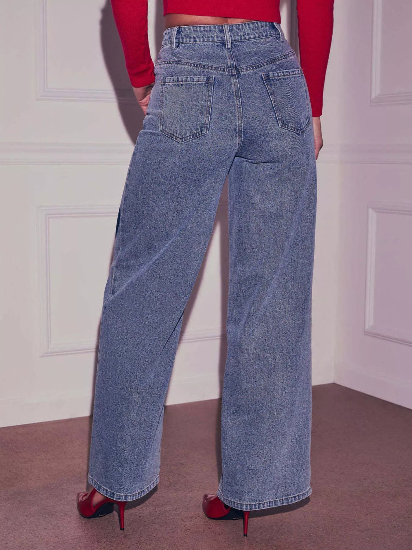 Light blue heart-embellished high waist wide-leg denim jeans by Trendsi, showing the front view with a relaxed fit.