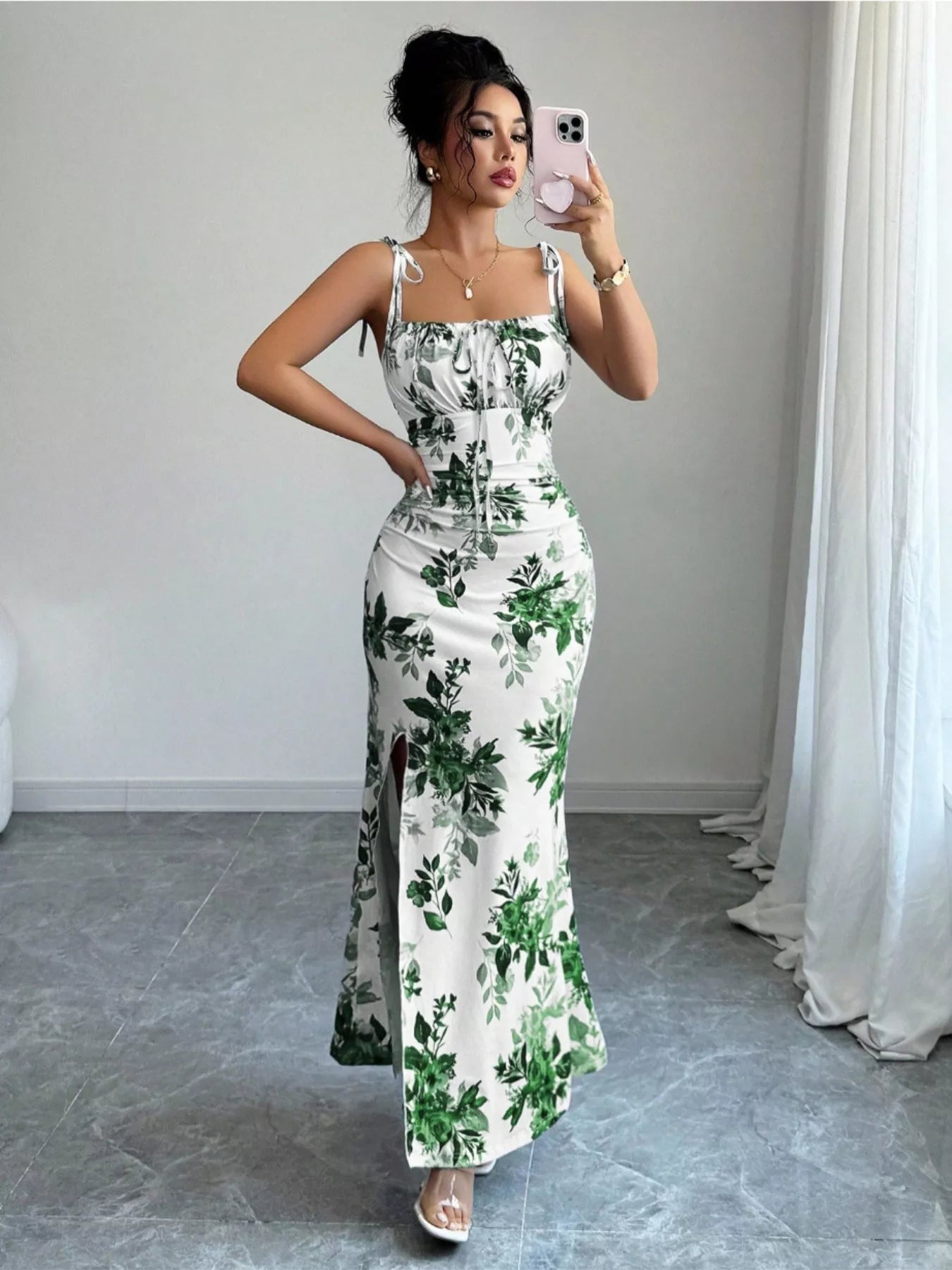 Printed tie-strap slit maxi dress by Trendsi featuring a flowy design, slit skirt, and adjustable tie straps for a stylish look.