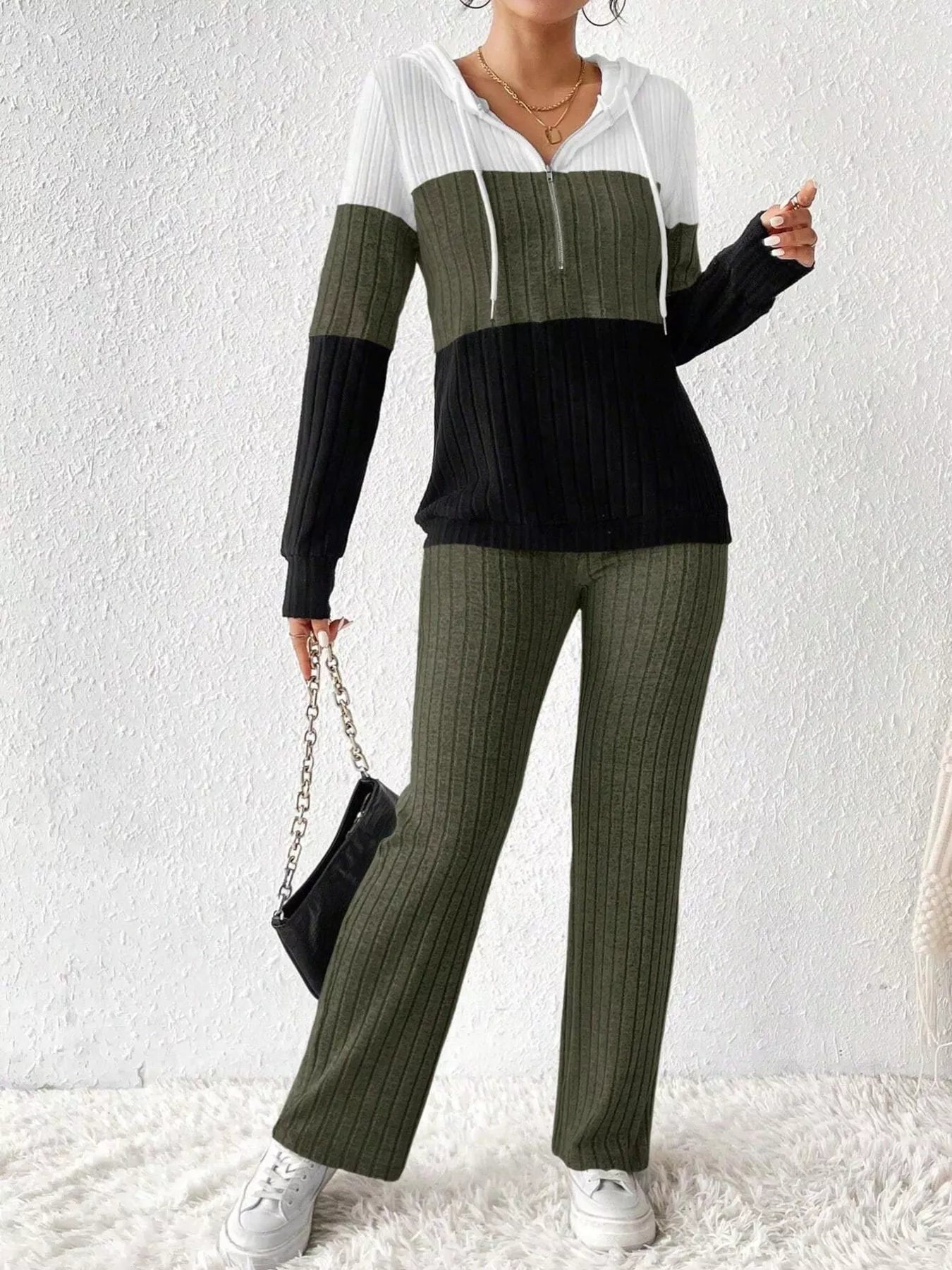 Color block half zip hooded top and matching pants set by Trendsi, featuring stylish color blocking and a comfortable fit.