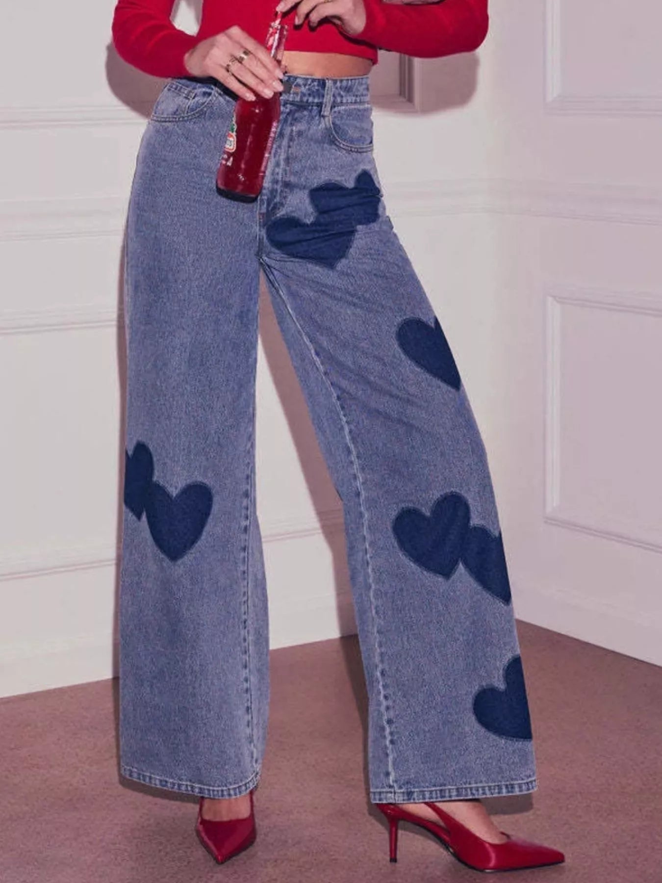 Heart high waist wide leg denim jeans from Trendsi, showing a stylish fit and classic blue wash with visible stitching and pockets.