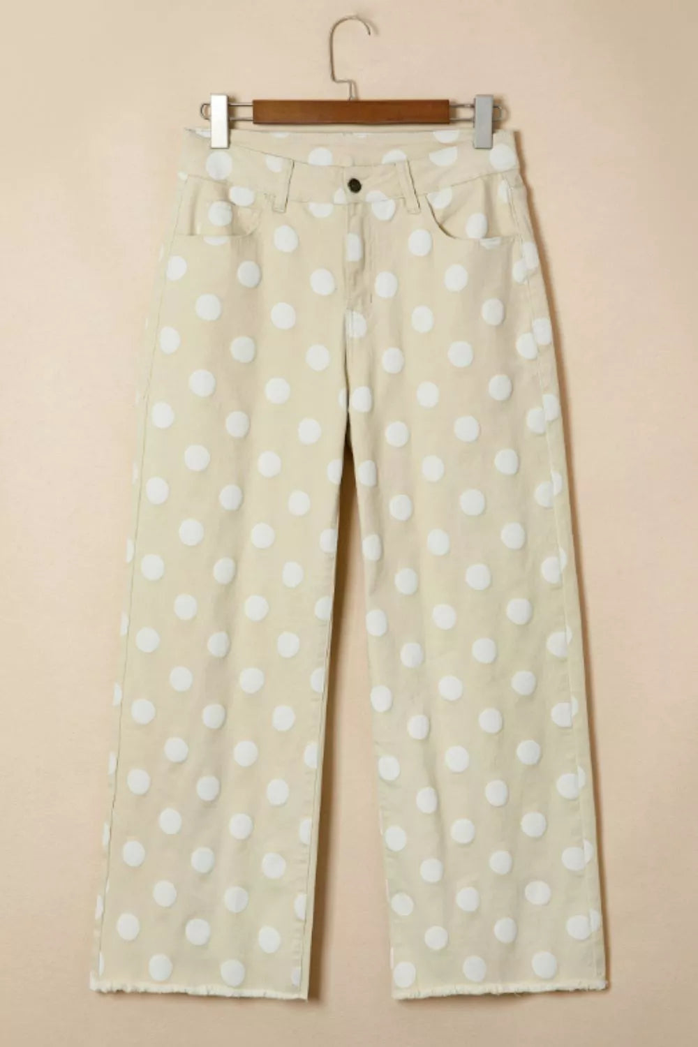 Polka dot high-waisted wide-leg jeans from Trendsi, featuring a vintage-inspired design and relaxed fit.