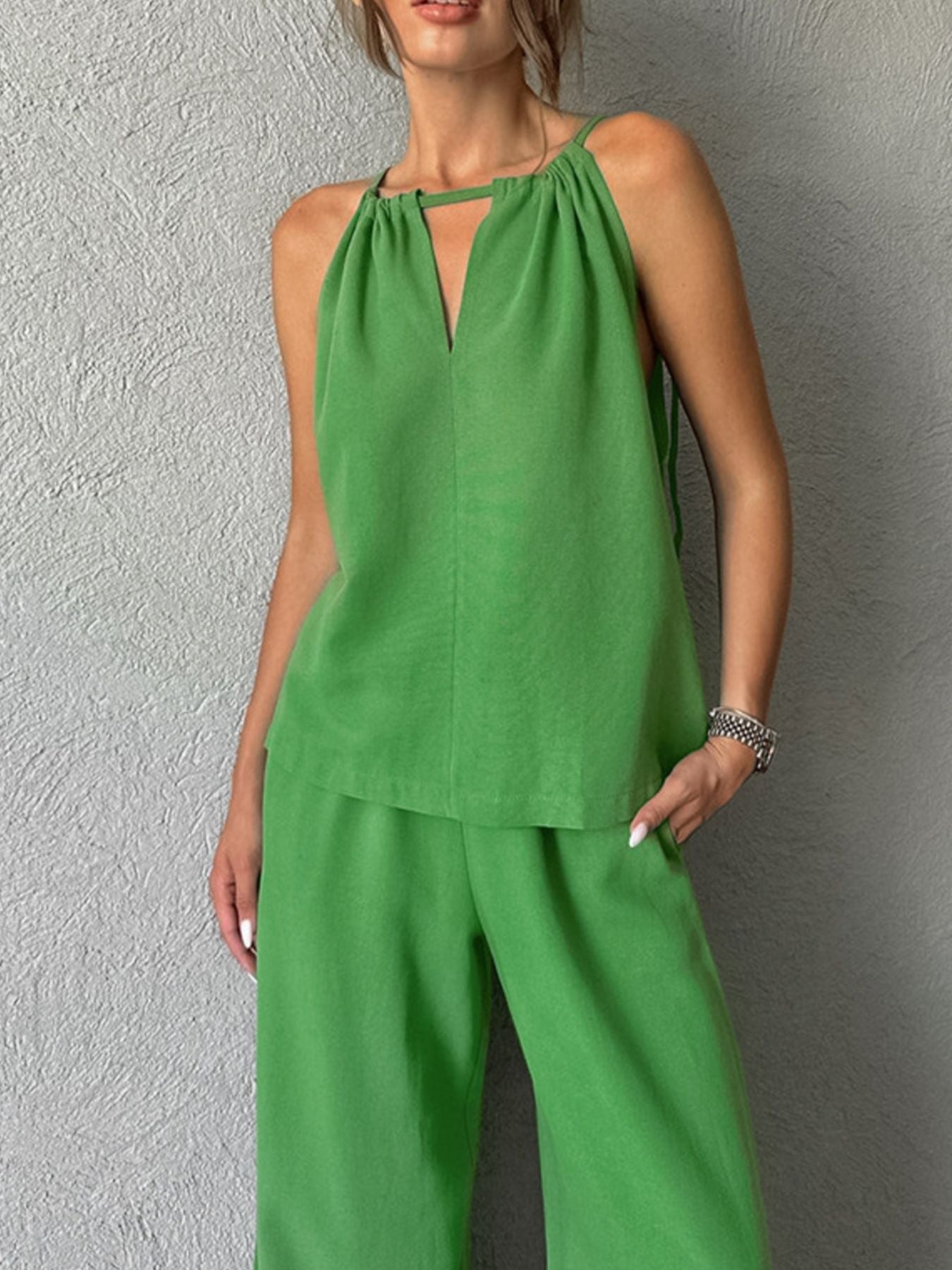 Trendsi cutout tank top and wide-leg pants set, featuring a stylish sleeveless top with cutout details and flowy wide-leg trousers.