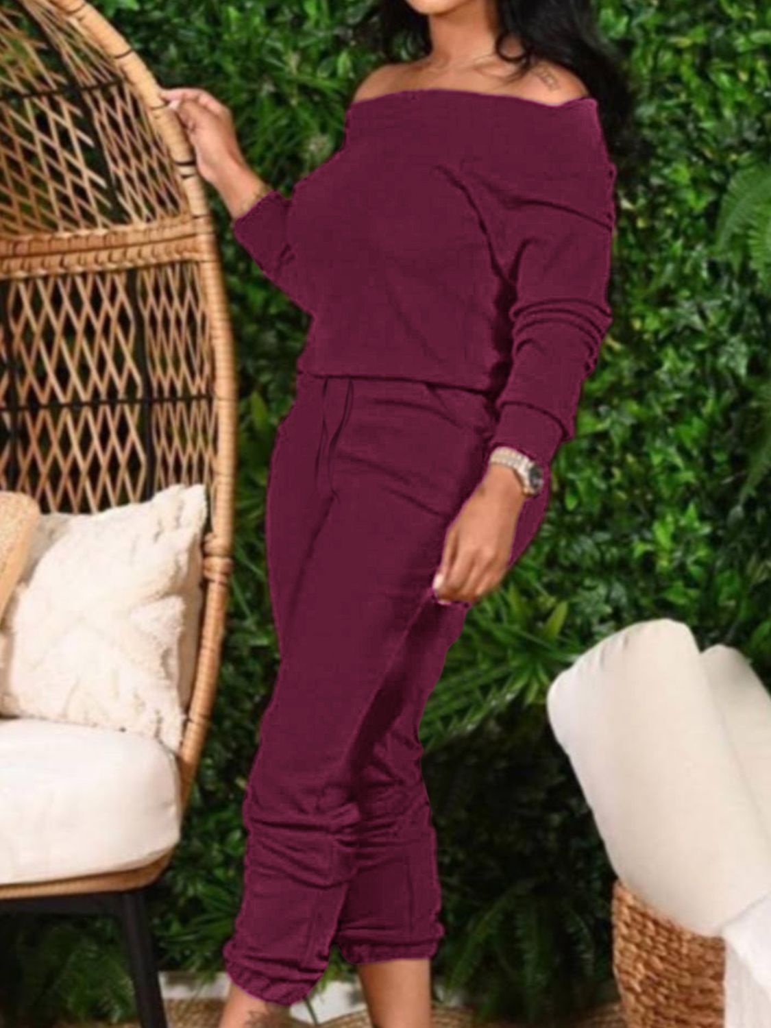 Burgundy off-shoulder top and cropped pants set by Trendsi, featuring stylish fit and comfortable fabric, displayed on a model.
