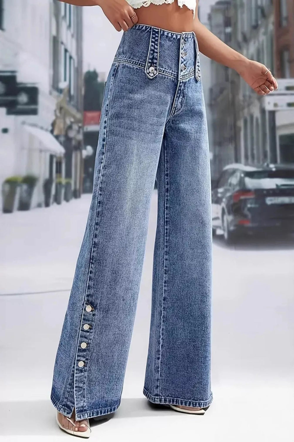 High waist denim jeans with button details and wide-leg style from Trendsi, shown in a natural pose.