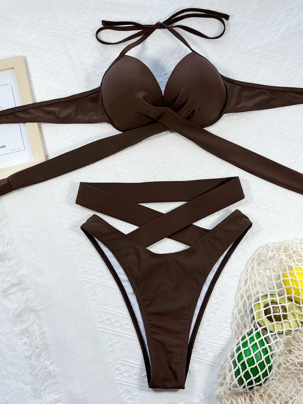 Trendsi crisscross halter neck bikini set with stylish swimwear design featuring adjustable straps and vibrant colors.