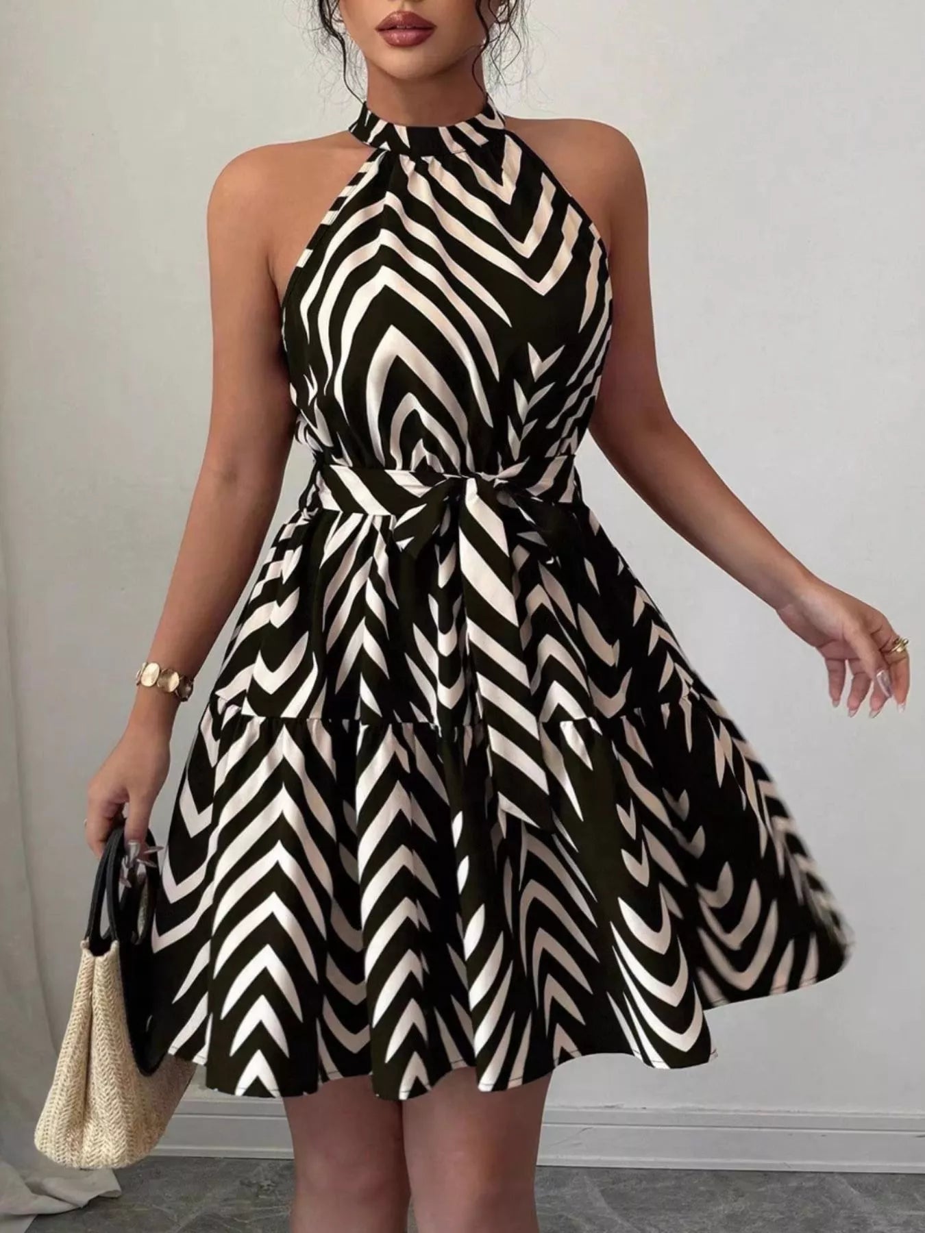 Zebra print halter neck dress with tie waist and ruffle hem, trendy fashion dress from Trendsi.