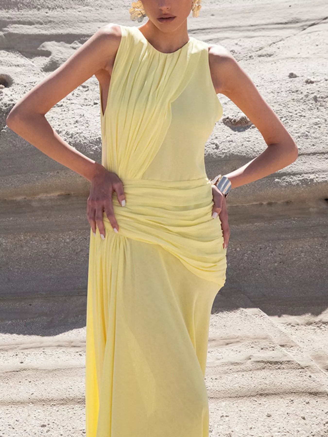 Yellow sleeveless ruched high-slit maxi dress by Trendsi, showcasing a flowing fabric, high slit, and ruched bodice design.
