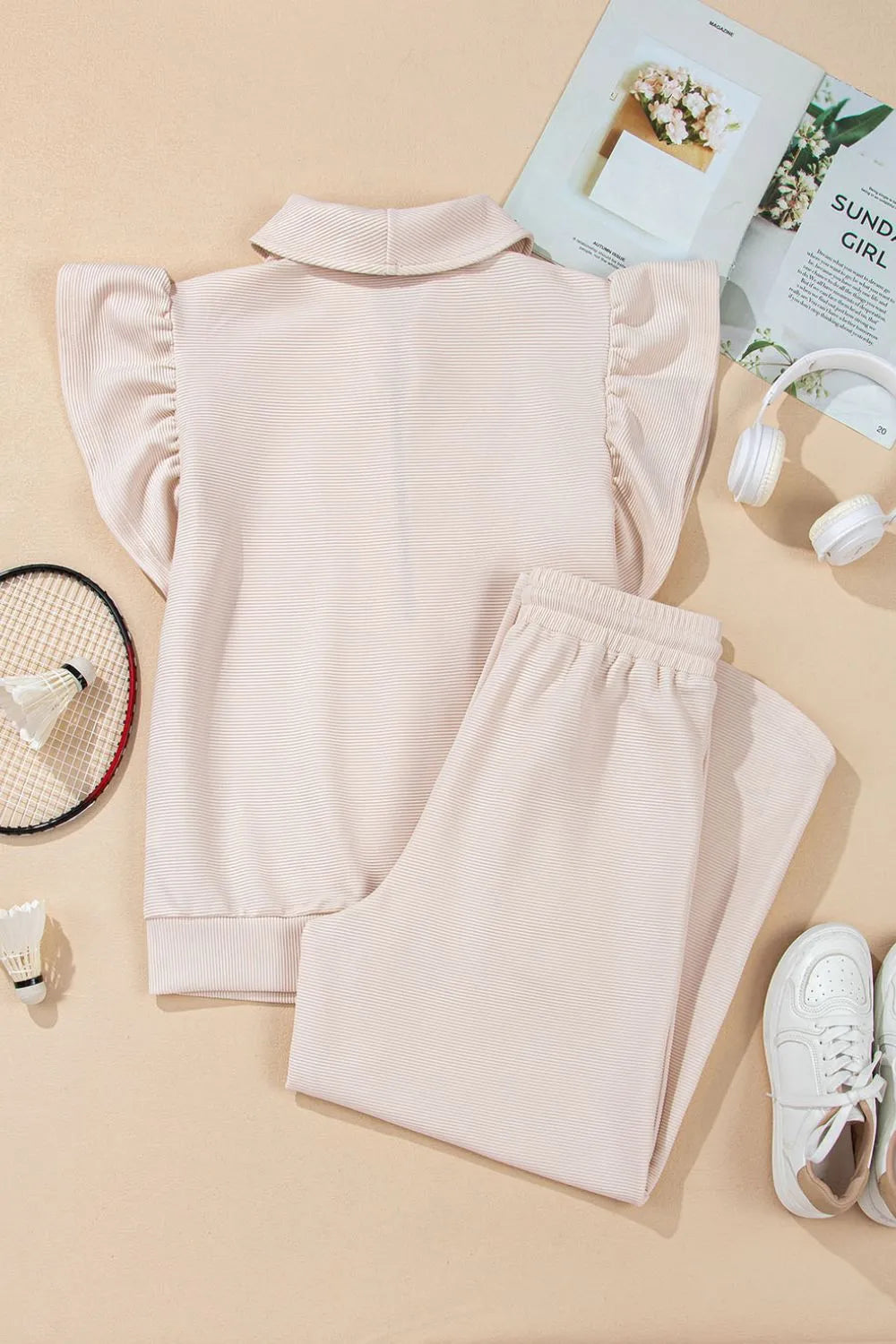 Textured ruffled sleeve zipped top and wide-leg pants set by Trendsi, featuring stylish design and comfortable fit.