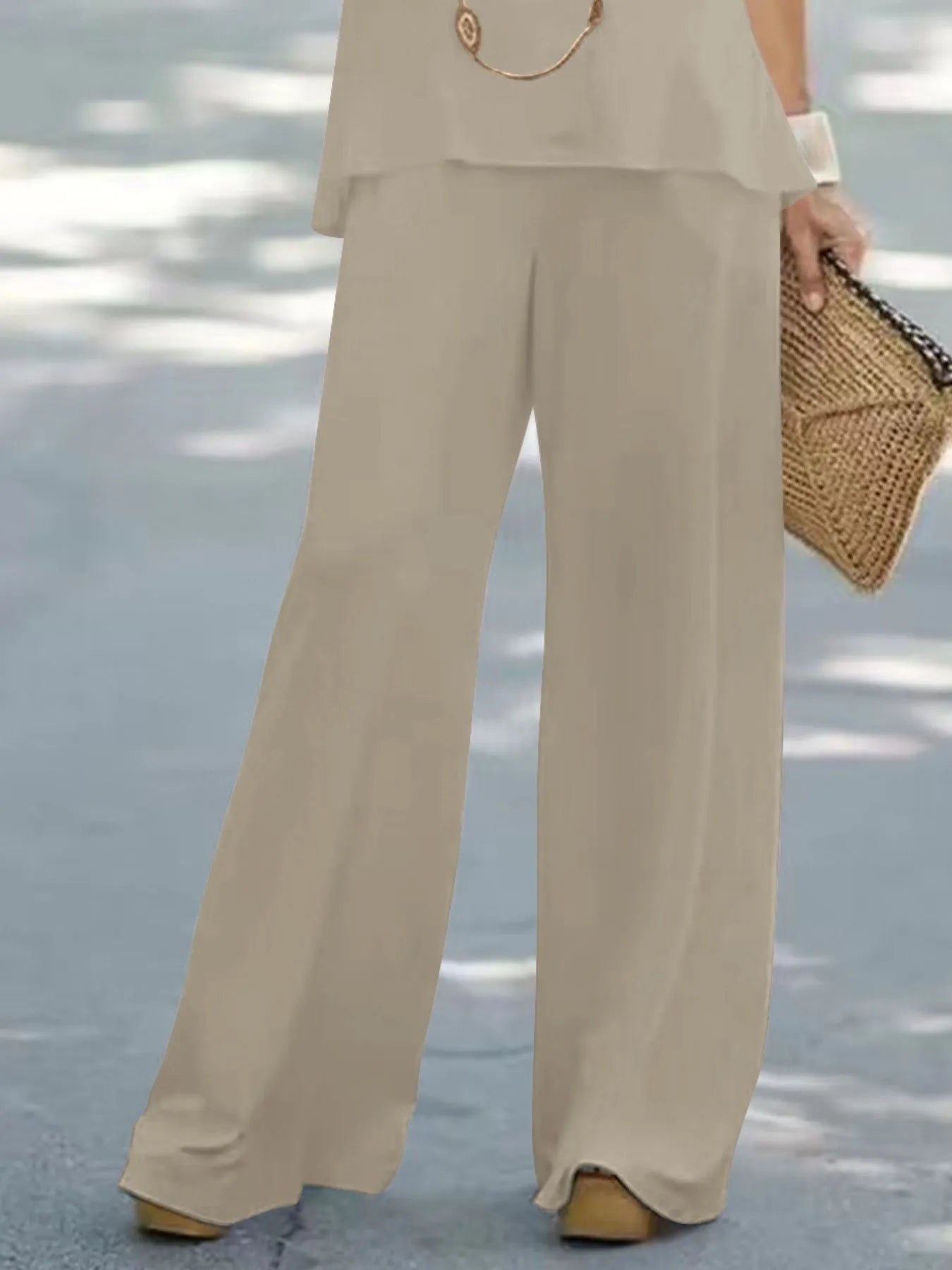 Trendsi halter top and wide-leg pants set, stylish sleeveless top with high-waisted flowing trousers, perfect for summer wear.