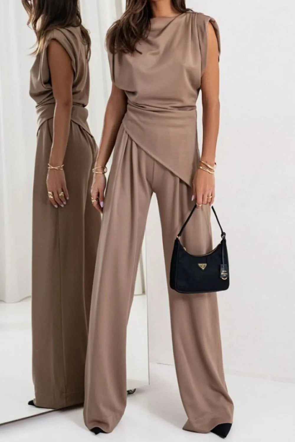Draped sleeveless asymmetric top and matching pants set in neutral fabric, stylish fashion ensemble by Trendsi.