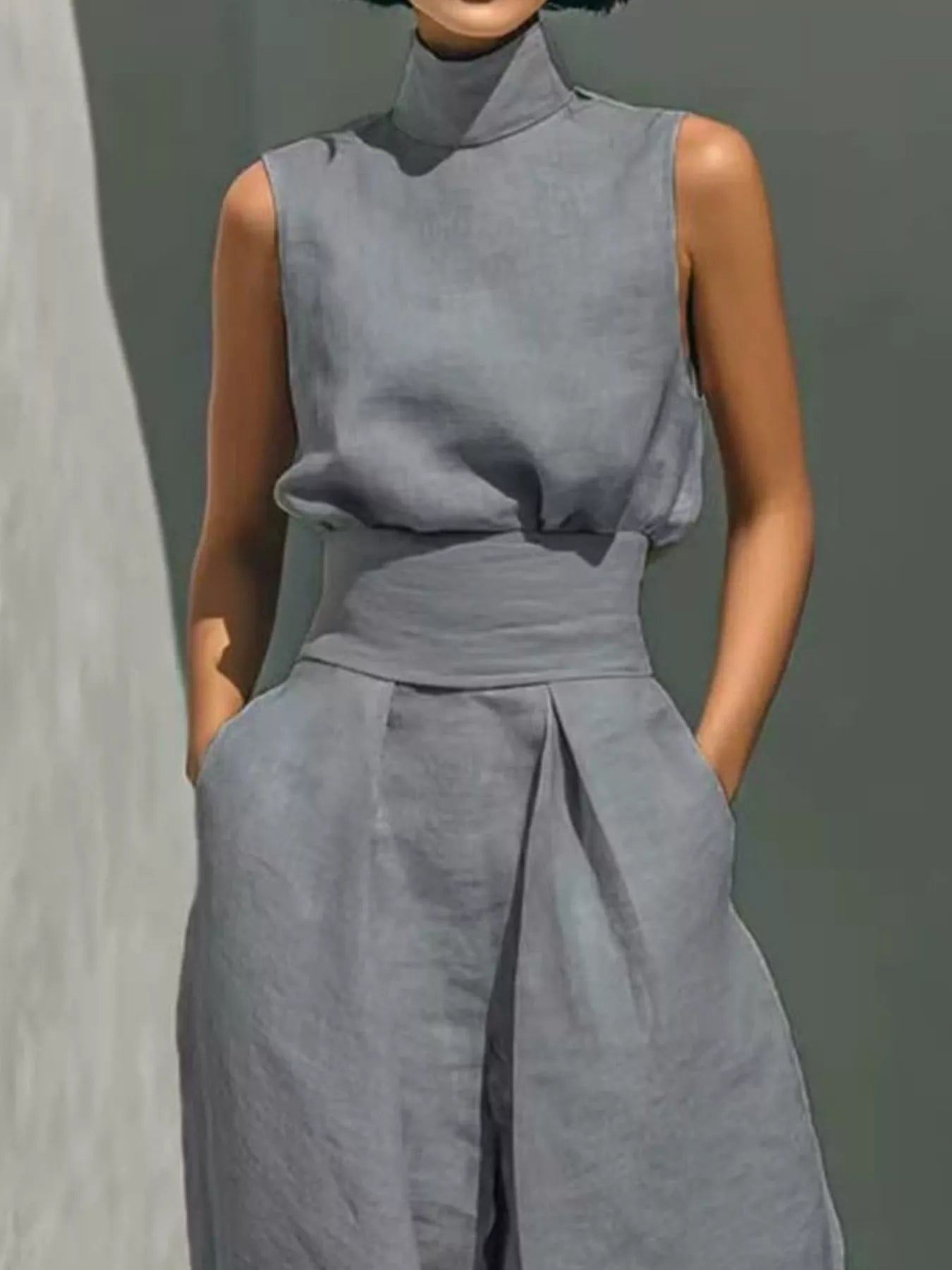 Trendsi high neck sleeveless top and wide leg pants 2-piece set, stylish and modern with a sleek fit and neutral color.