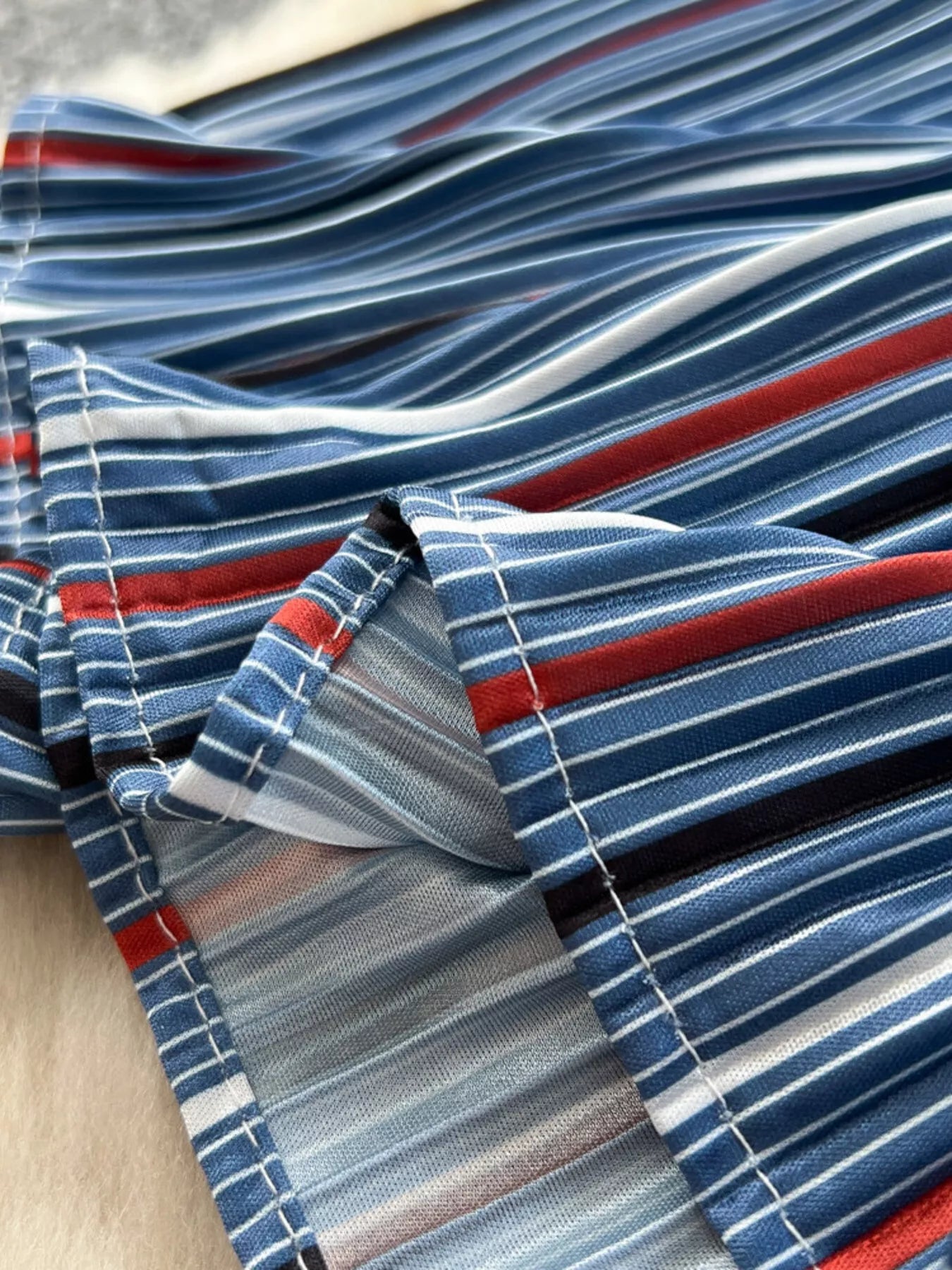 Striped patchwork denim skirt from Trendsi, featuring a stylish mix of colorful denim patches and a classic A-line silhouette.