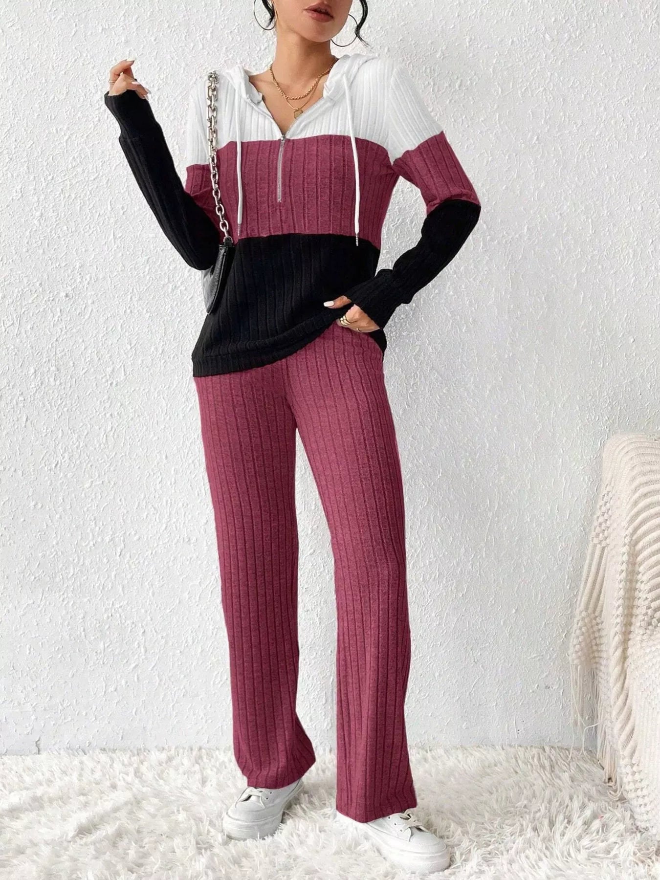 Color block half zip hooded top and matching pants set by Trendsi, featuring vibrant color blocks and comfortable fit.