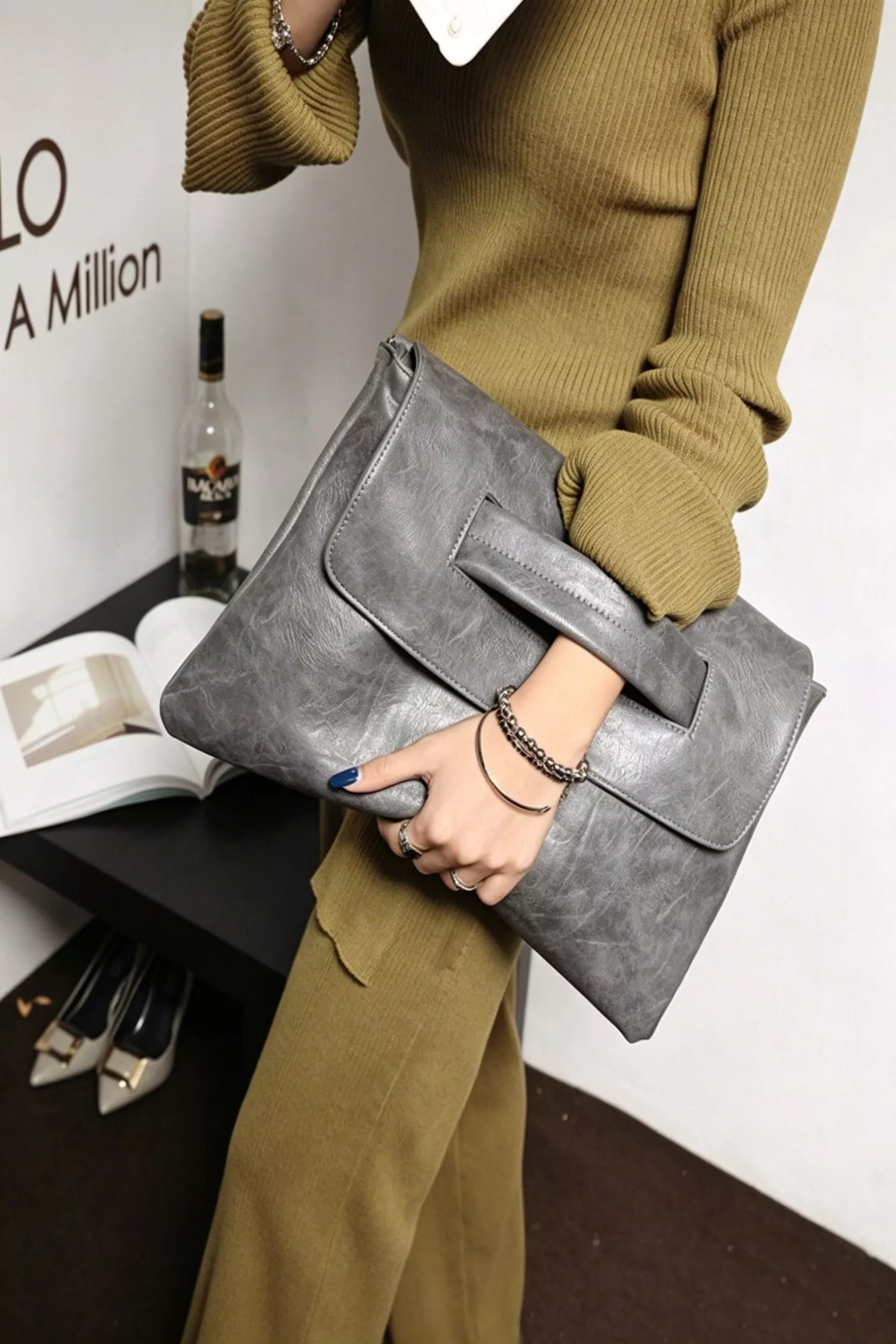 Vintage style envelope clutch handbag with a sleek design and classic flap closure, perfect for elegant occasions.