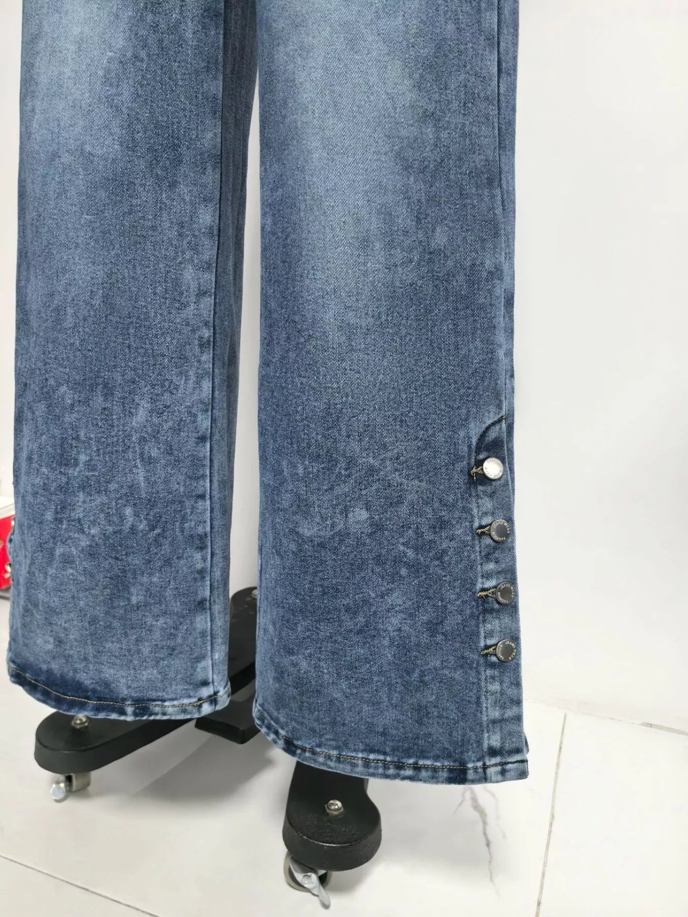 High waist denim wide-leg jeans with button decor, stylish trendy Trendsi denim pants shown in the image.