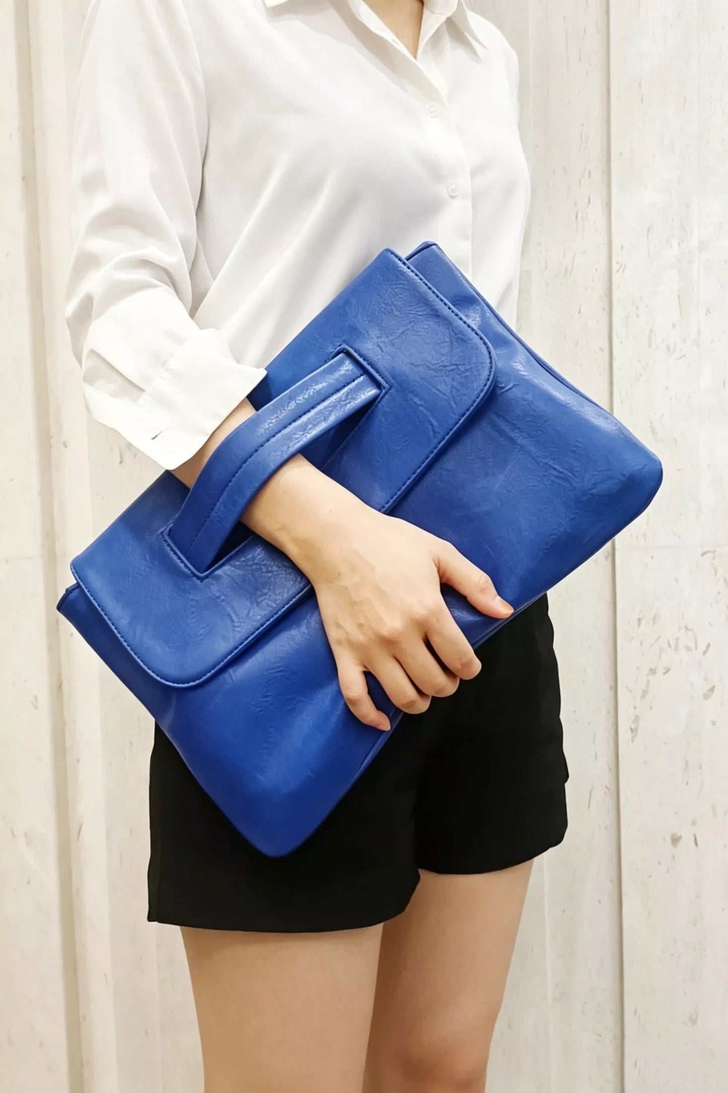 Vintage style envelope clutch handbag by Trendsi, featuring a sleek design and elegant fold-over flap.